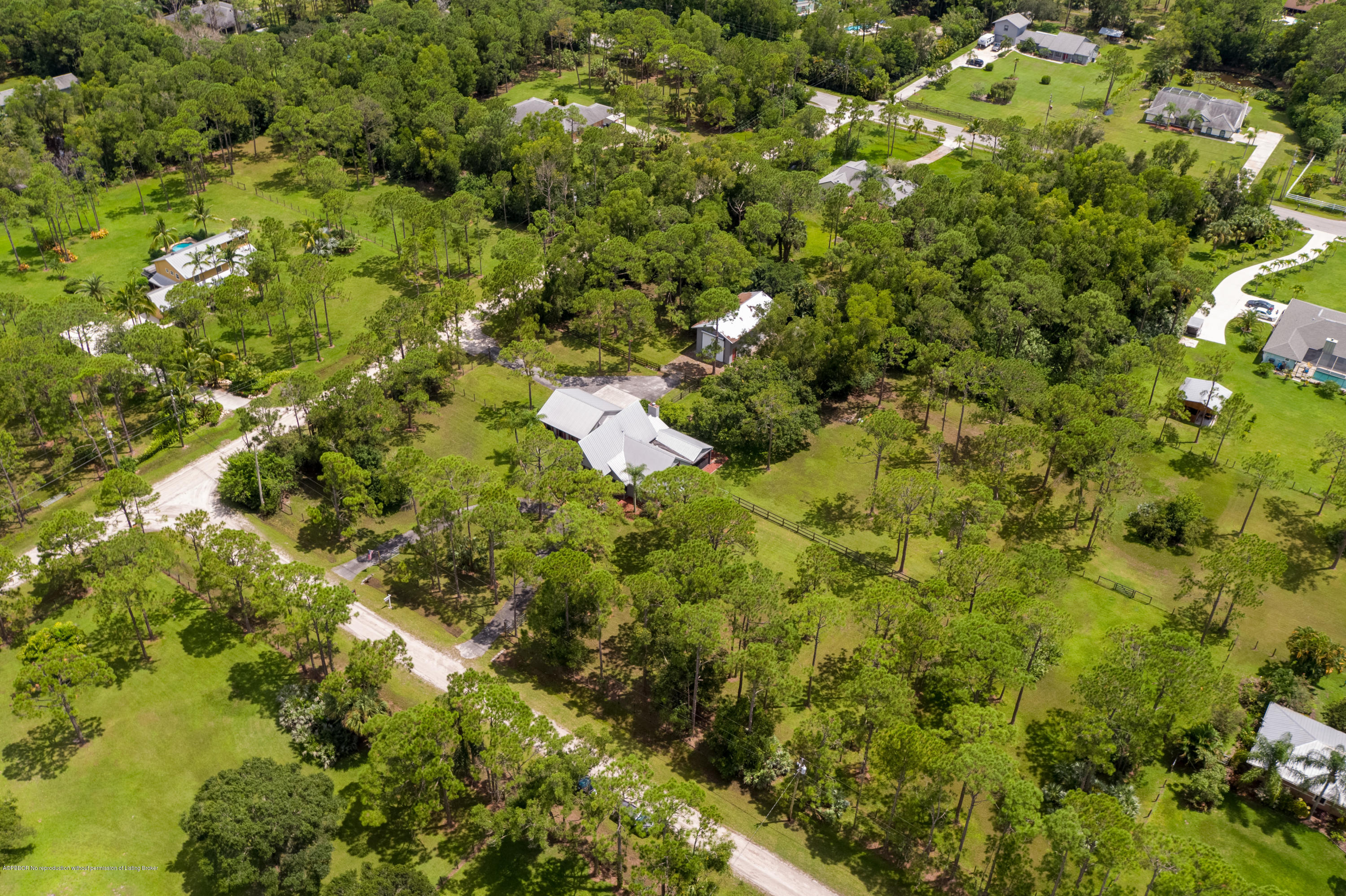 12142 157th Street North Jupiter, FL 33478 - Photo 3 of 49 a view of a bunch of trees and bushes