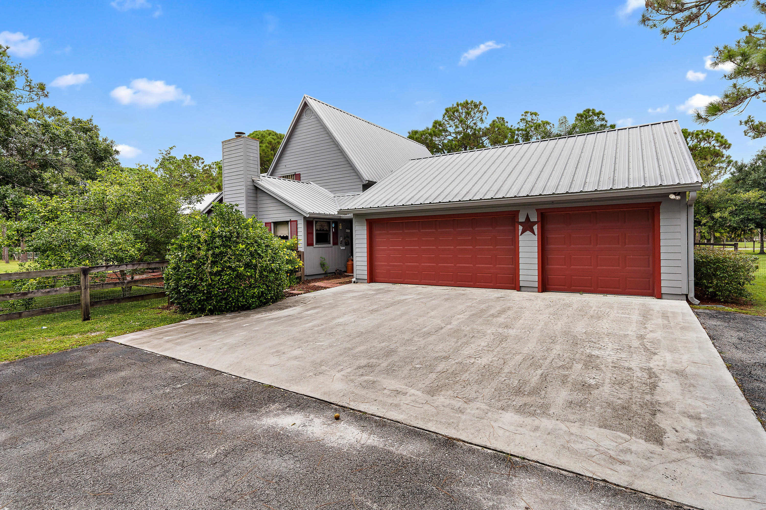 12142 157th Street North Jupiter, FL 33478 - Photo 21 of 49 a house view with a garden space