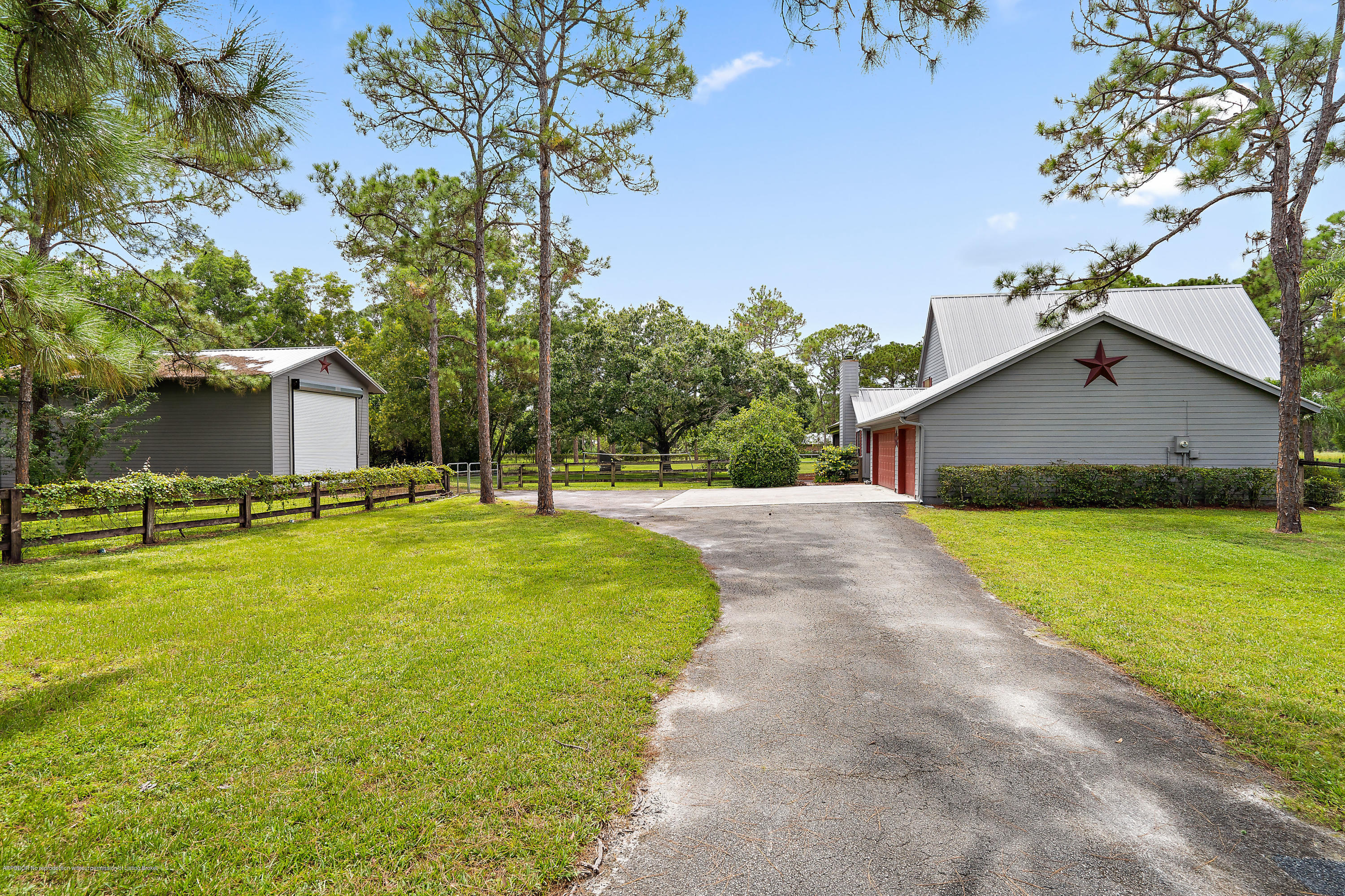 12142 157th Street North Jupiter, FL 33478 - Photo 22 of 49 a view of a house with pool and a yard