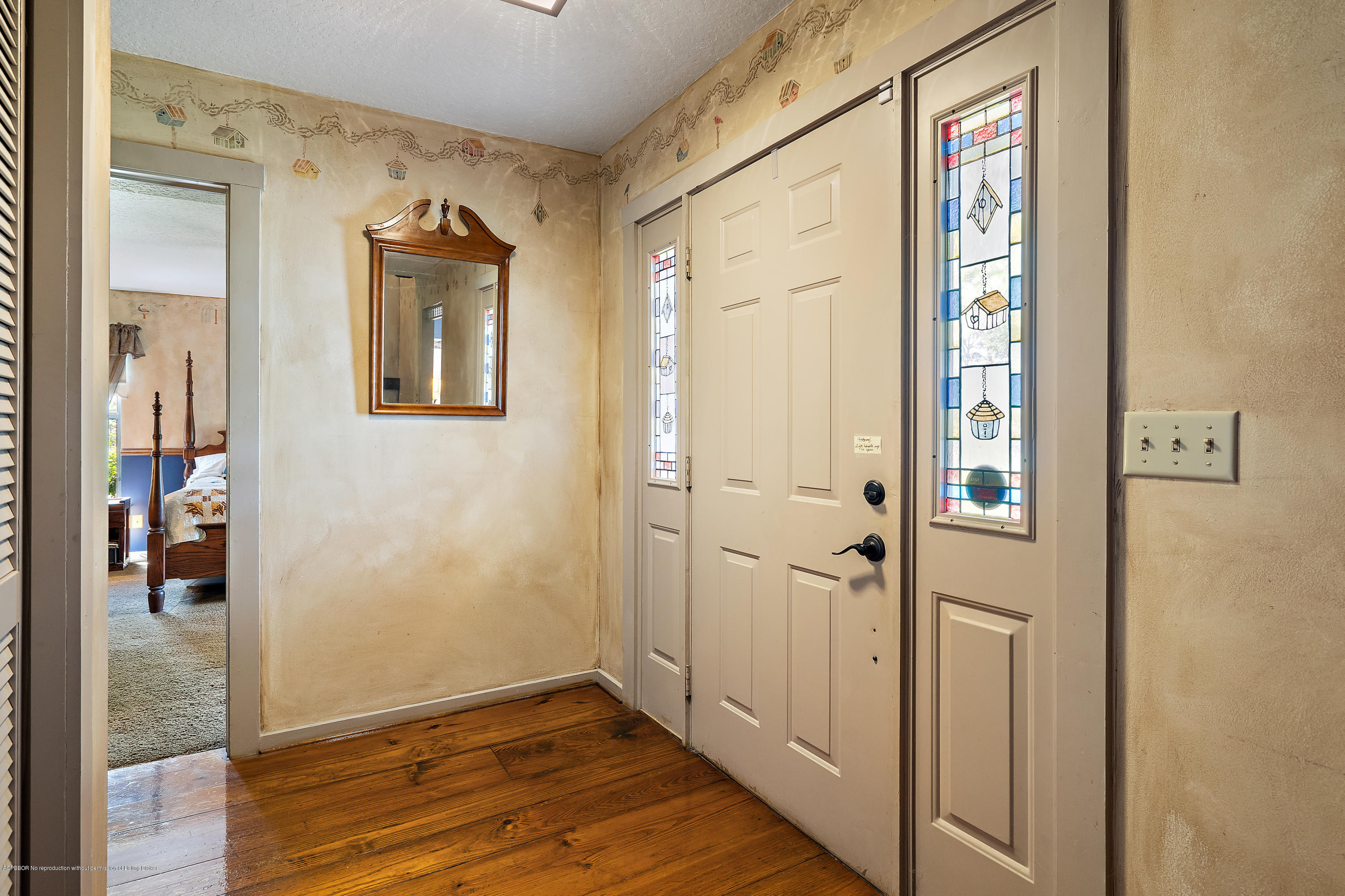 12142 157th Street North Jupiter, FL 33478 - Photo 30 of 49 a view of a hallway with wooden floor and entryway