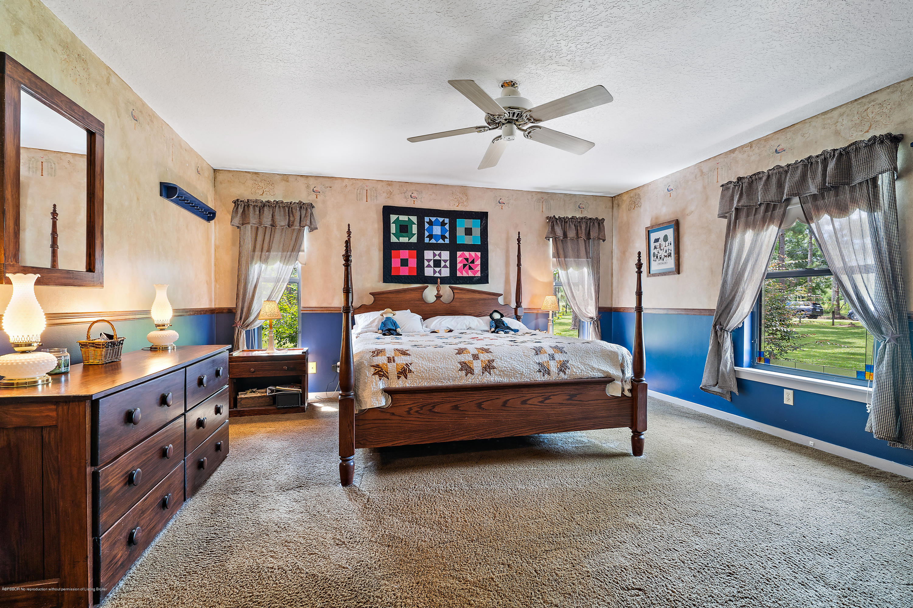 12142 157th Street North Jupiter, FL 33478 - Photo 31 of 49 a bedroom with a bed and a large window