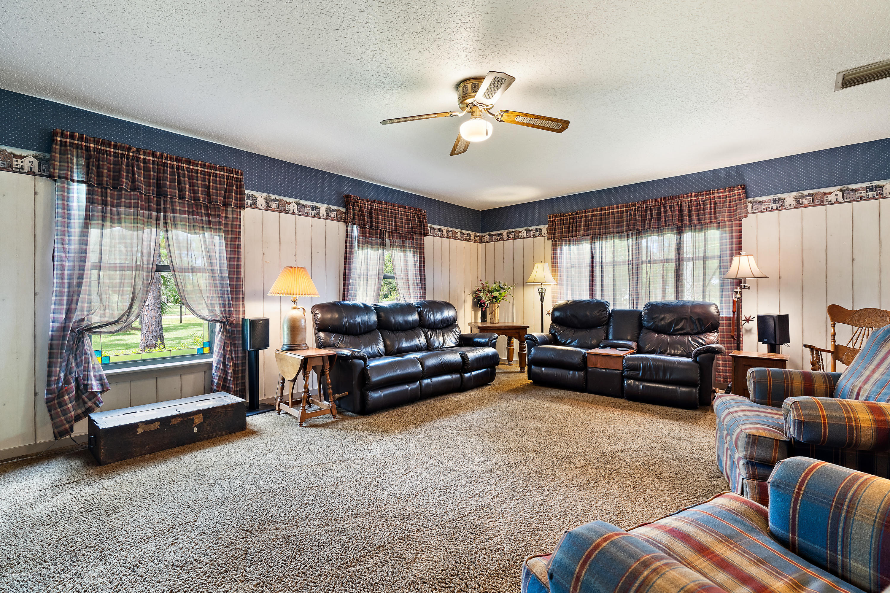 12142 157th Street North Jupiter, FL 33478 - Photo 35 of 49 a living room with furniture and a large window