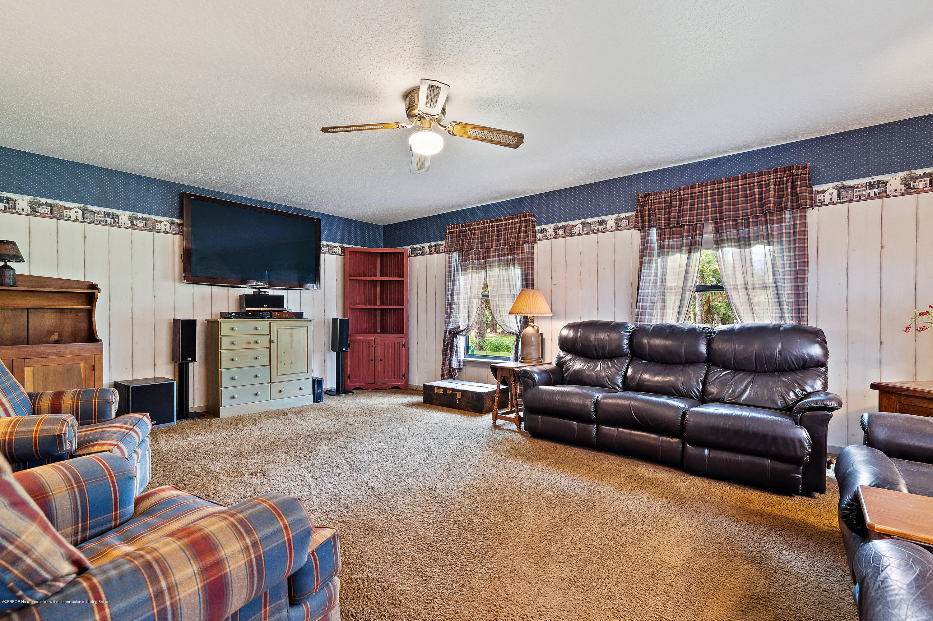 12142 157th Street North Jupiter, FL 33478 - Photo 36 of 49 a living room with furniture and a window