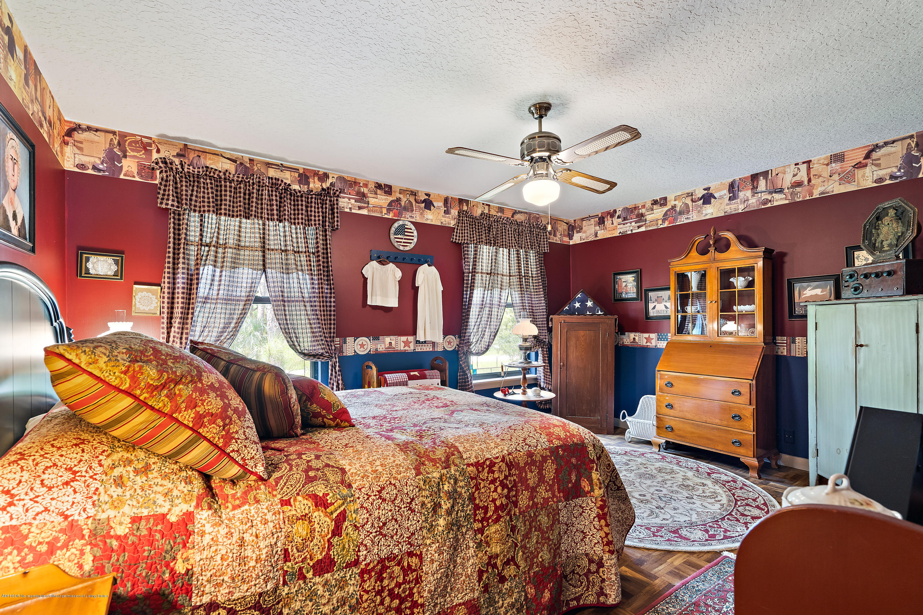 12142 157th Street North Jupiter, FL 33478 - Photo 41 of 49 a bedroom with a bed and wooden floor