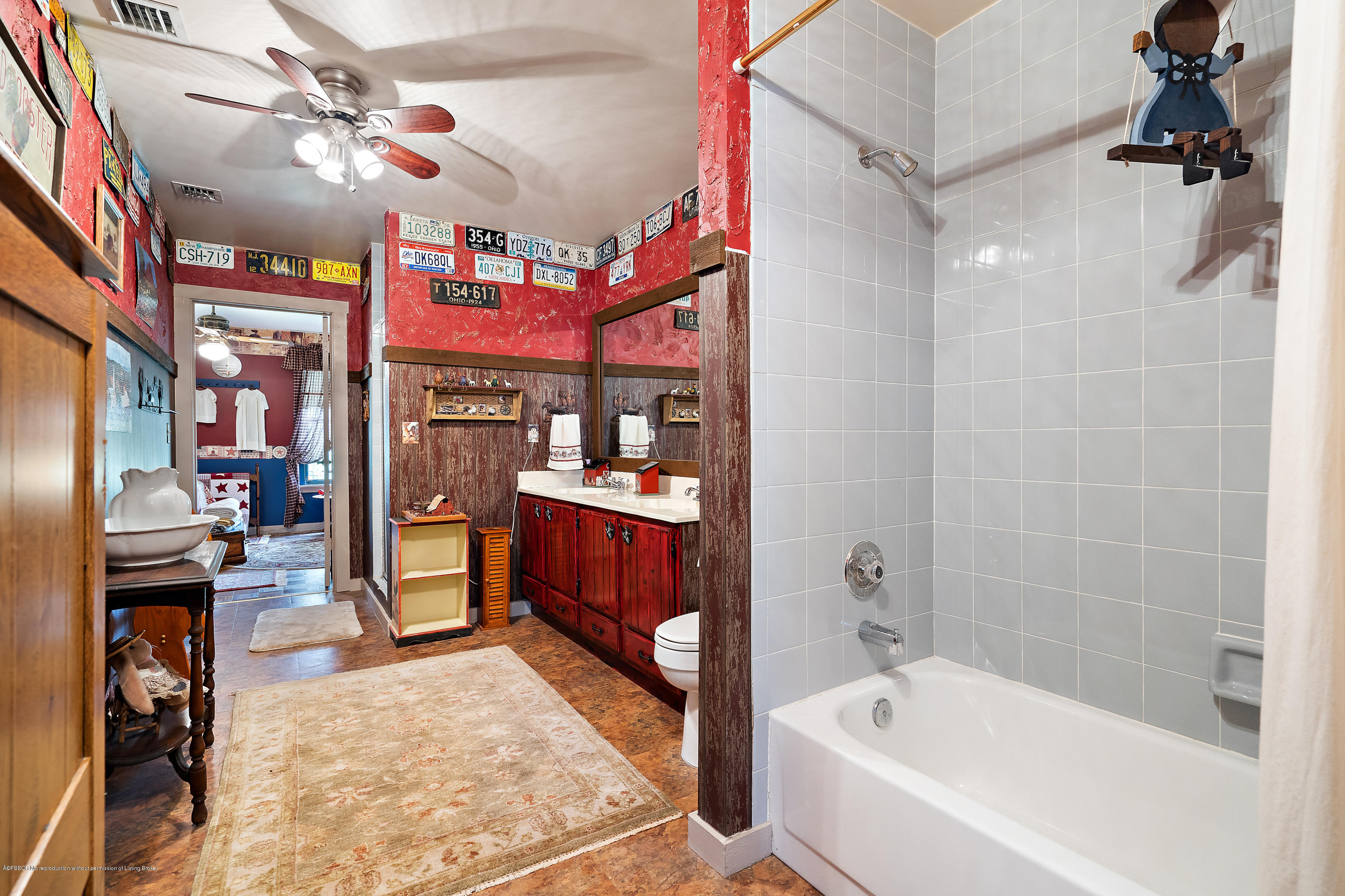 12142 157th Street North Jupiter, FL 33478 - Photo 44 of 49 a bathroom with a tub a sink and a shower