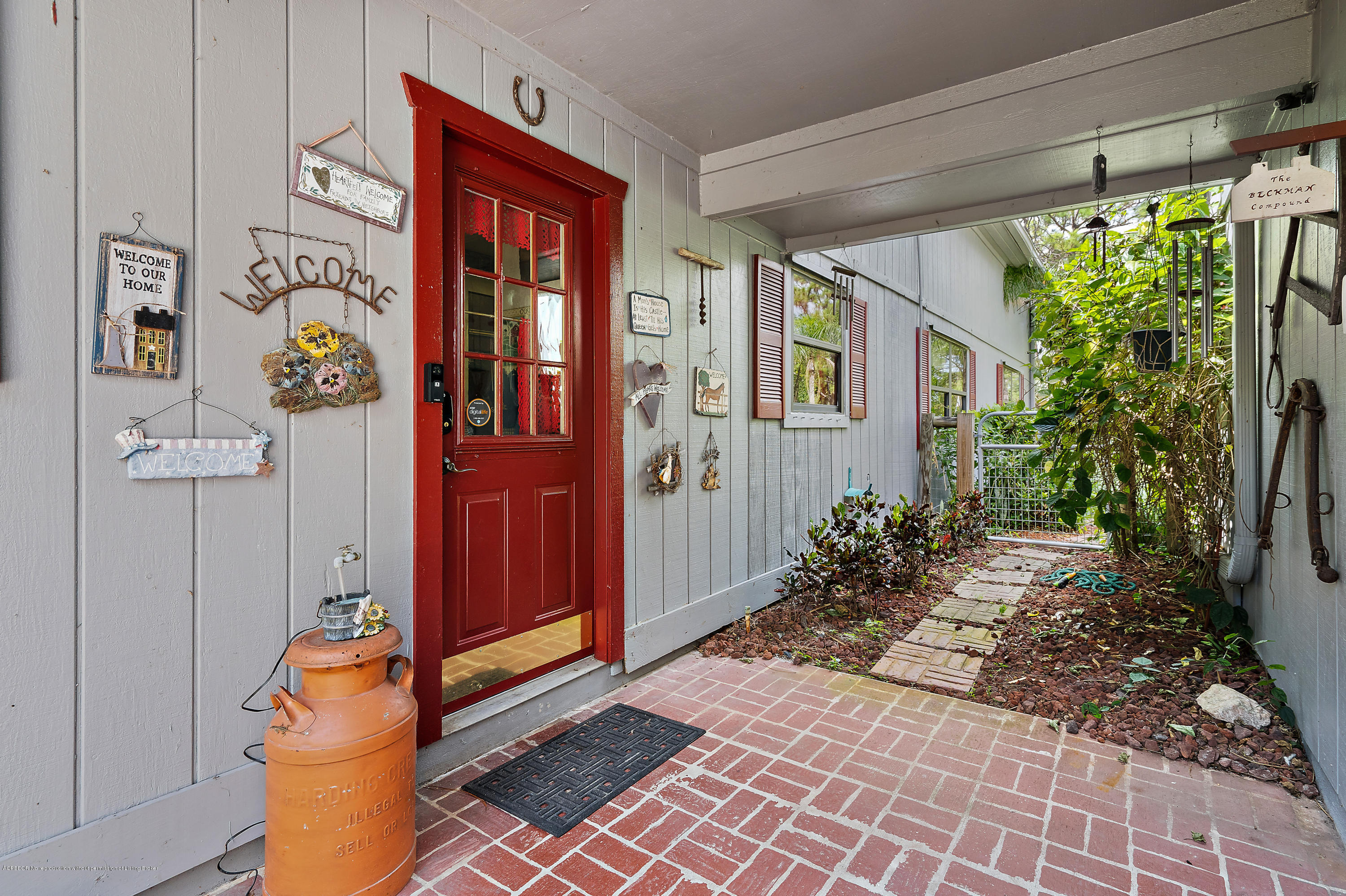 12142 157th Street North Jupiter, FL 33478 - Photo 49 of 49 a backyard of a house with outdoor seating