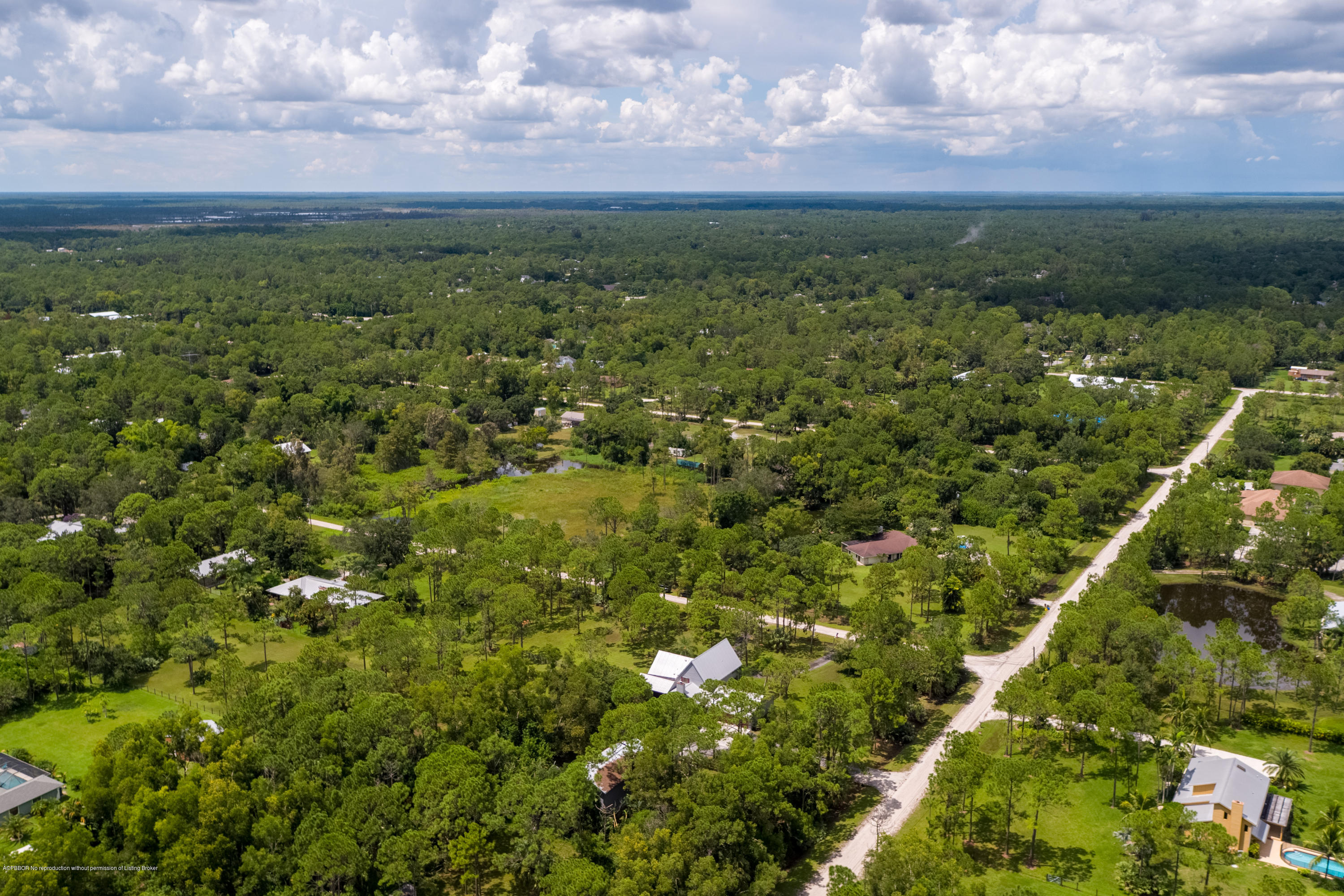 12142 157th Street North Jupiter, FL 33478 - Photo 6 of 49 a view of a city with lush green forest
