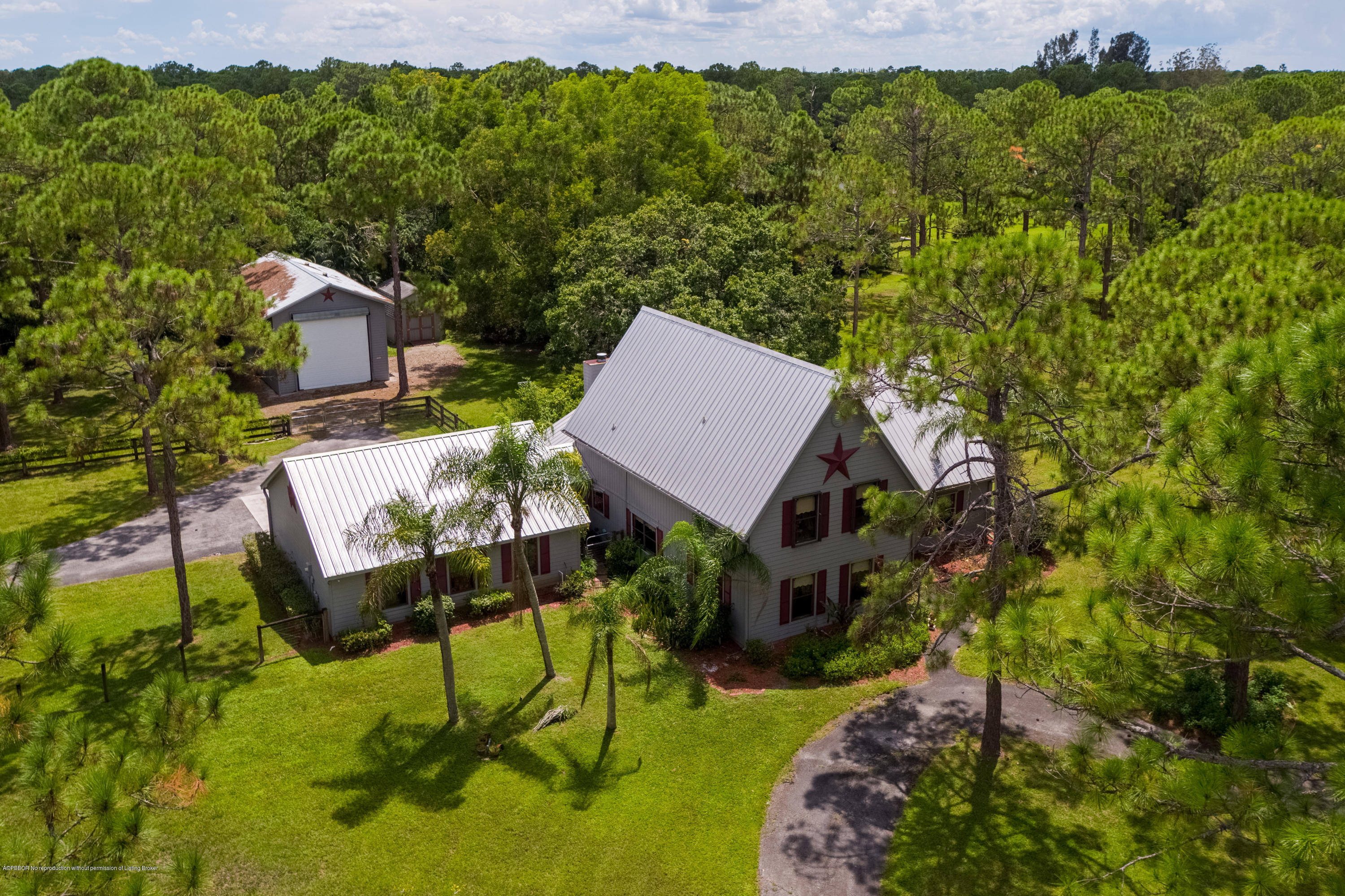 12142 157th Street North Jupiter, FL 33478 - Photo 8 of 49 a view of house with backyard and outdoor seating