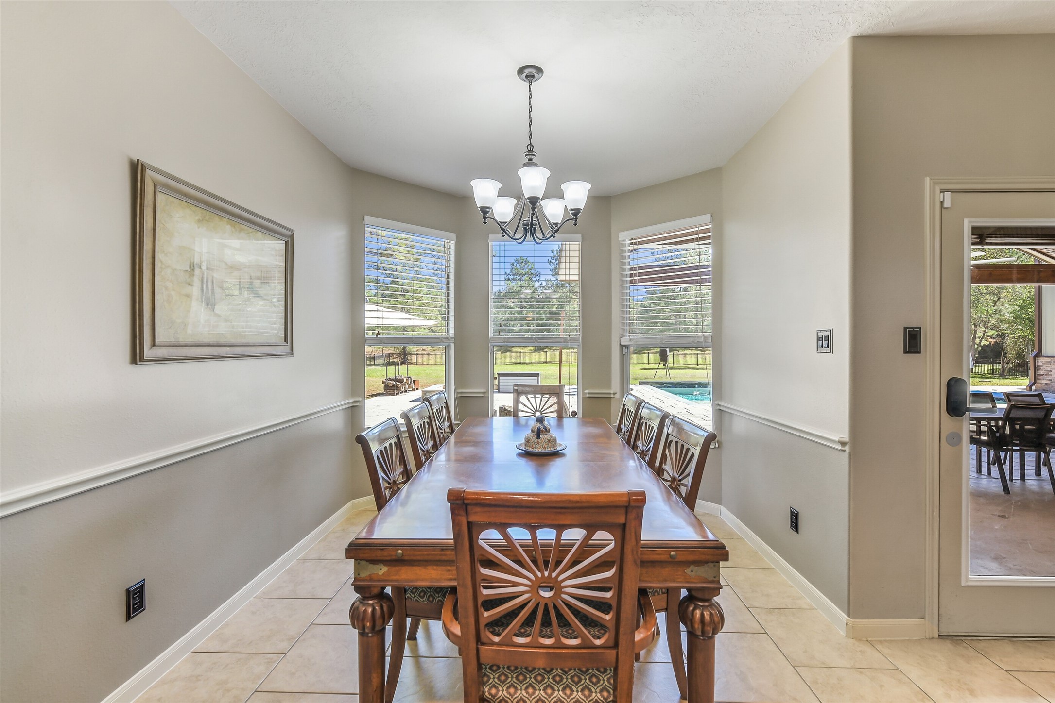 32711 Tall Oaks Way Magnolia, TX 77354 - Photo 12 of 50 a view of a dining room with furniture window and outside view