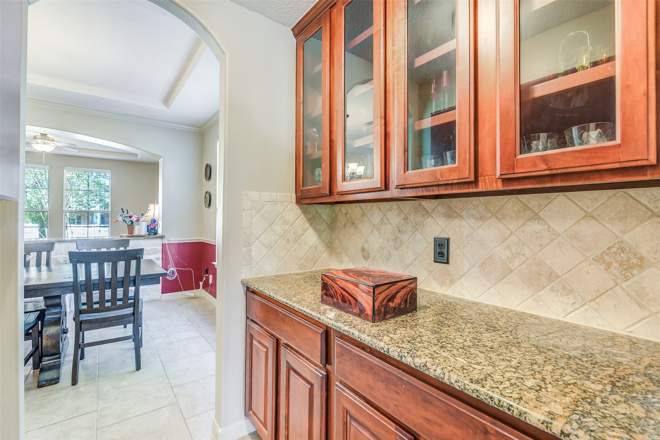 32711 Tall Oaks Way Magnolia, TX 77354 - Photo 13 of 50 a kitchen with a sink and a white cabinets next to a window