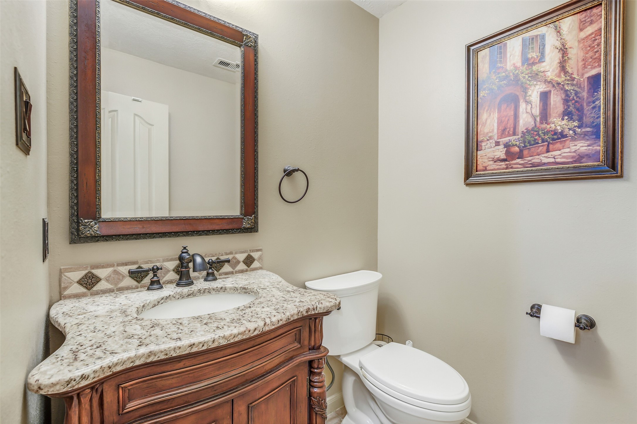 32711 Tall Oaks Way Magnolia, TX 77354 - Photo 19 of 50 a bathroom with a granite countertop toilet sink and mirror