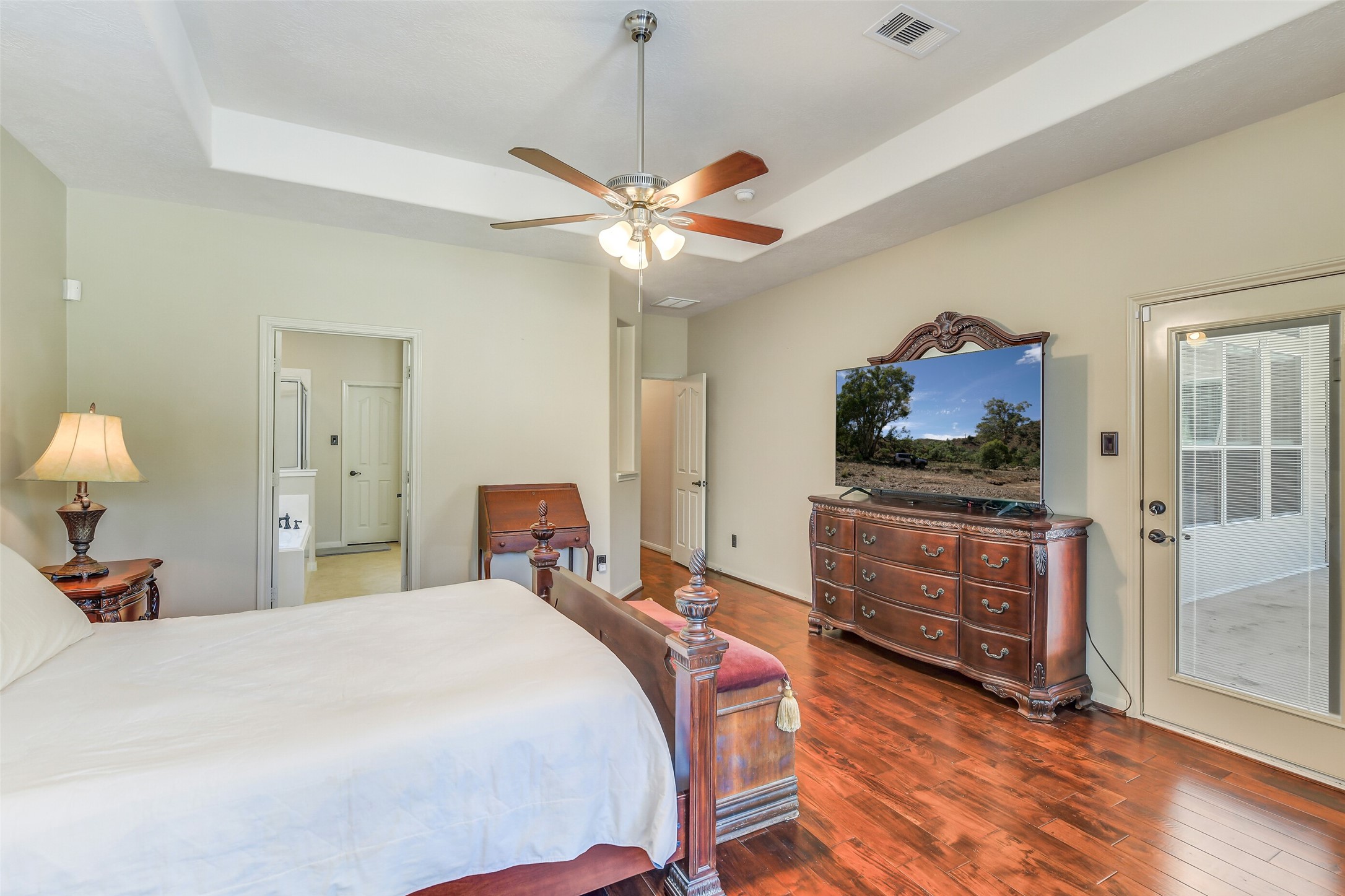 32711 Tall Oaks Way Magnolia, TX 77354 - Photo 22 of 50 a bedroom with a bed and wooden floor
