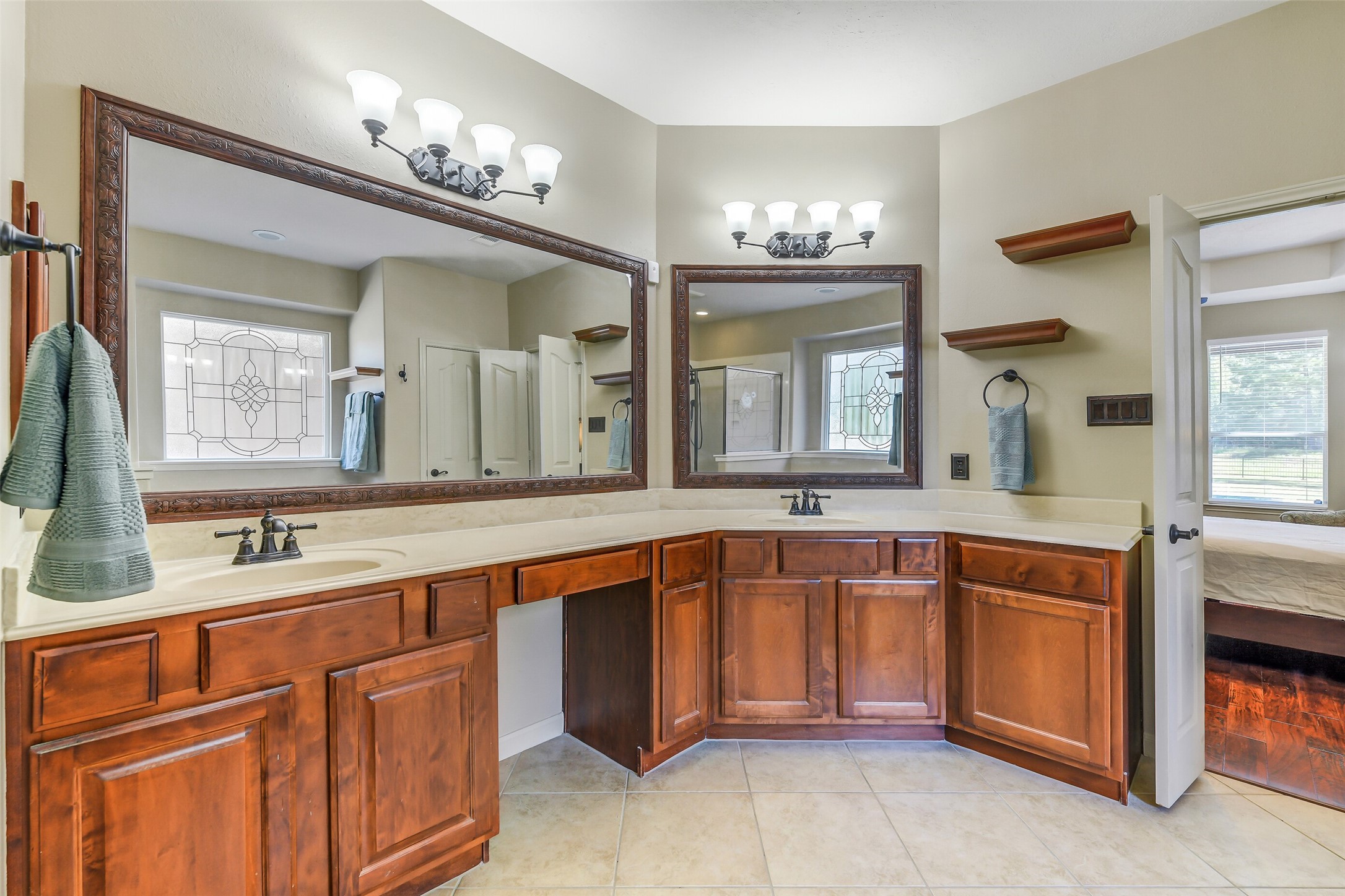 32711 Tall Oaks Way Magnolia, TX 77354 - Photo 24 of 50 a large bathroom with a sink and a large mirror