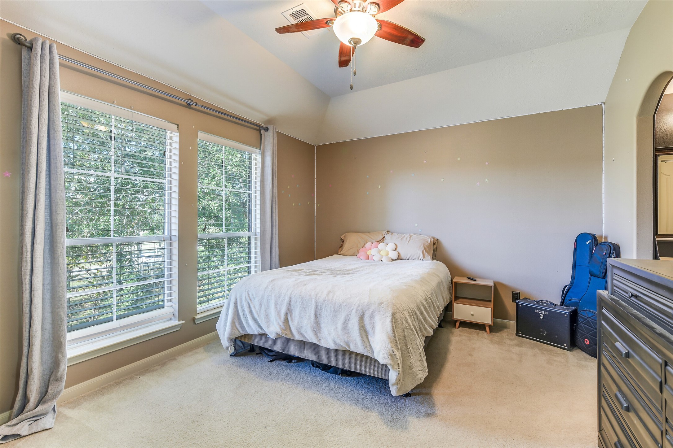 32711 Tall Oaks Way Magnolia, TX 77354 - Photo 30 of 50 a bedroom with bed and a chandelier