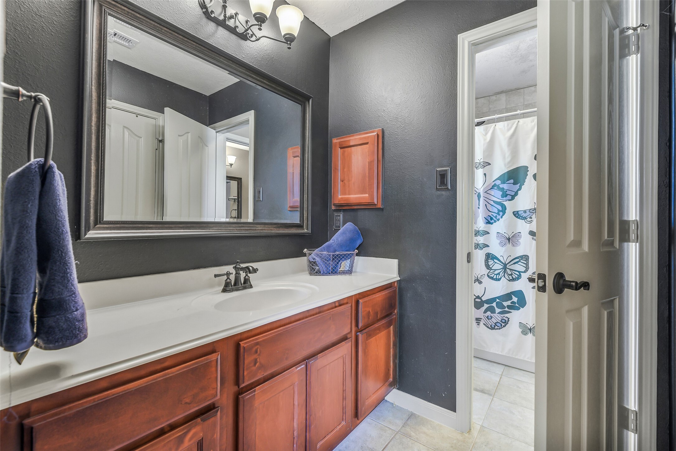 32711 Tall Oaks Way Magnolia, TX 77354 - Photo 31 of 50 a bathroom with a sink a vanity and a mirror