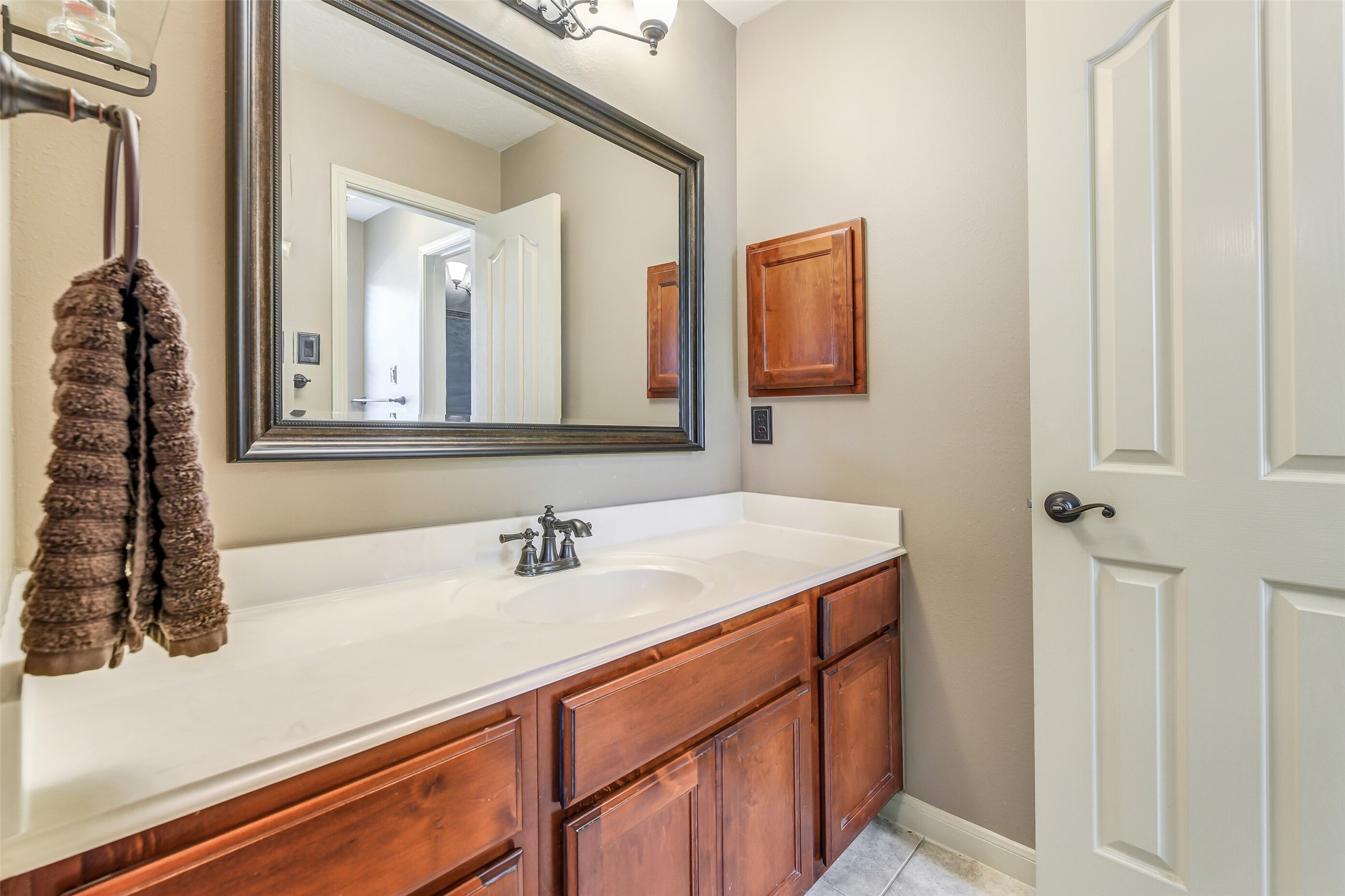 32711 Tall Oaks Way Magnolia, TX 77354 - Photo 33 of 50 a bathroom with a sink and a mirror