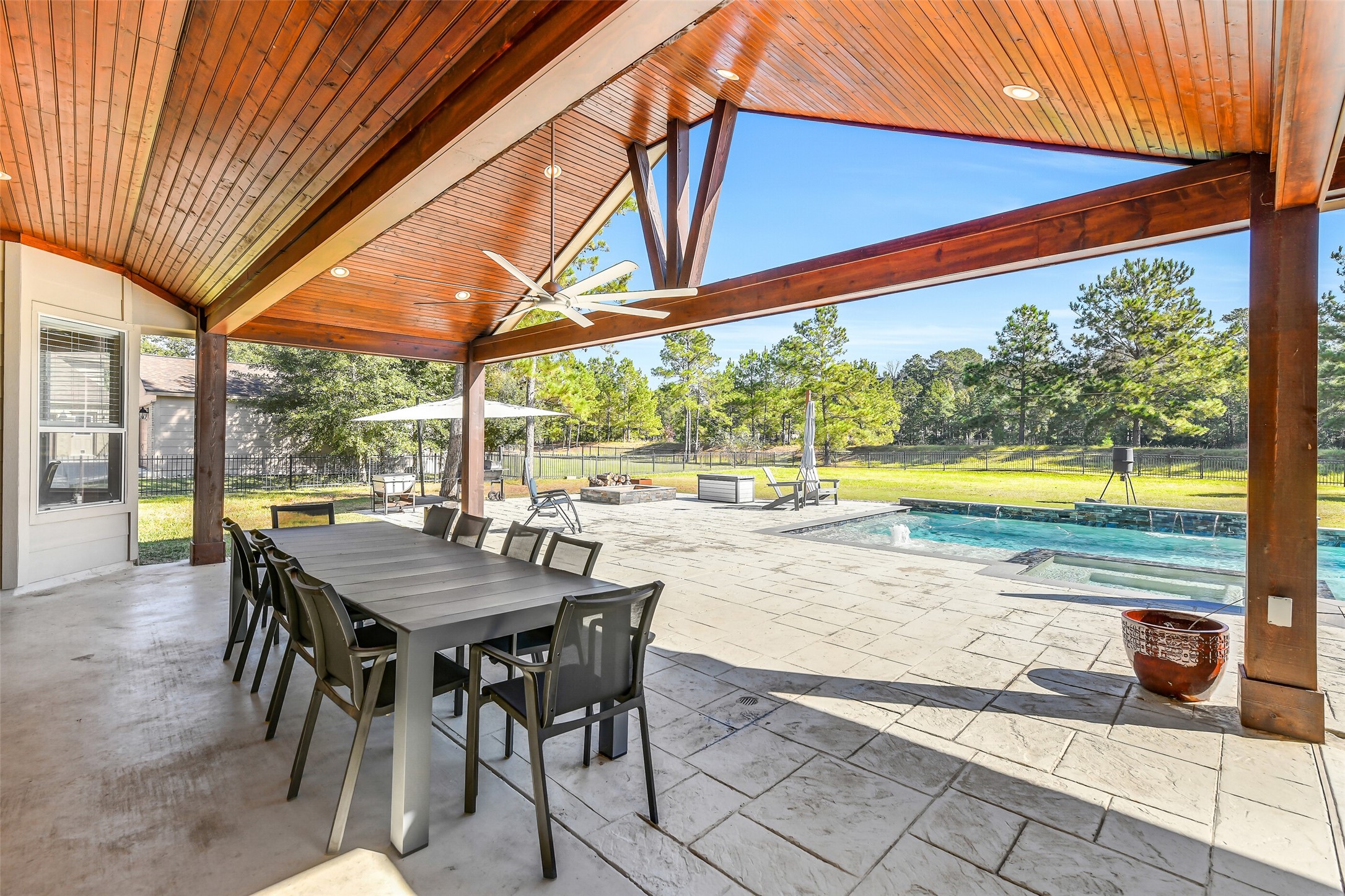 32711 Tall Oaks Way Magnolia, TX 77354 - Photo 34 of 50 a view of a patio with a table chairs and a patio