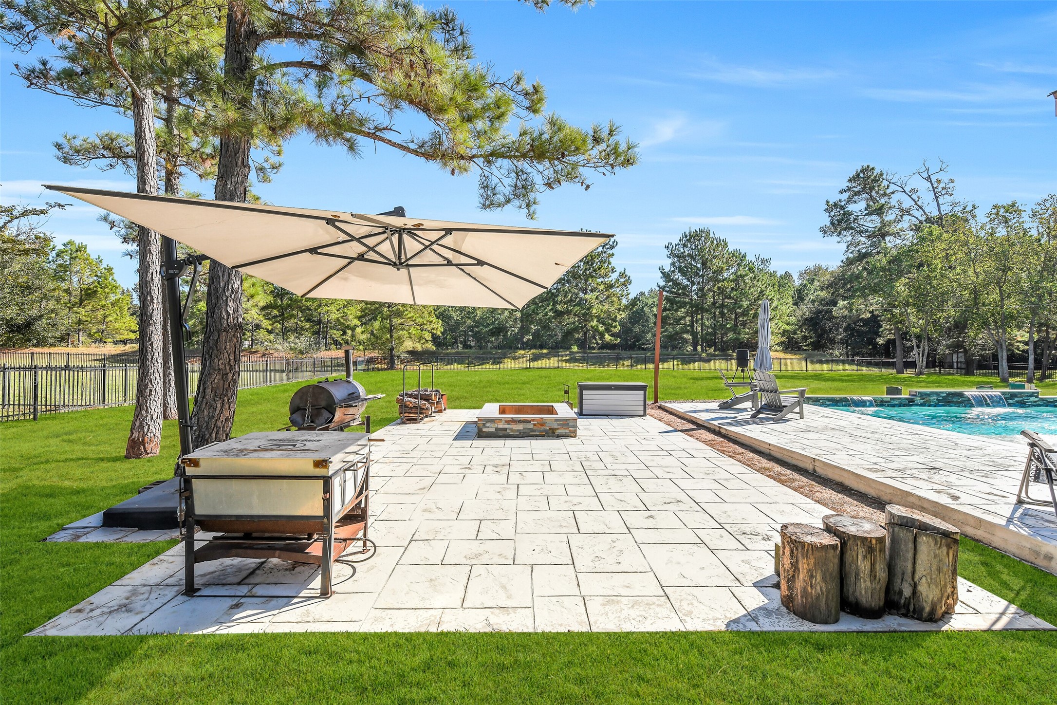 32711 Tall Oaks Way Magnolia, TX 77354 - Photo 39 of 50 a view of a patio with a table chairs and a yard