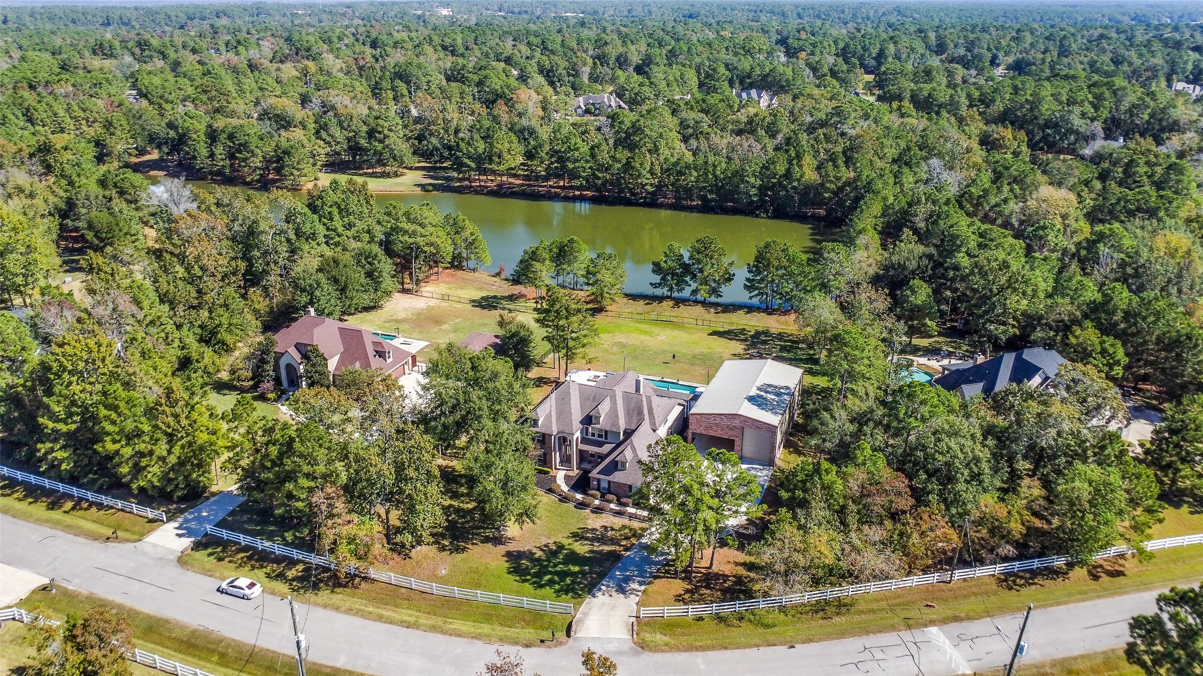 32711 Tall Oaks Way Magnolia, TX 77354 - Photo 50 of 50 an aerial view of residential house with outdoor space and lake view