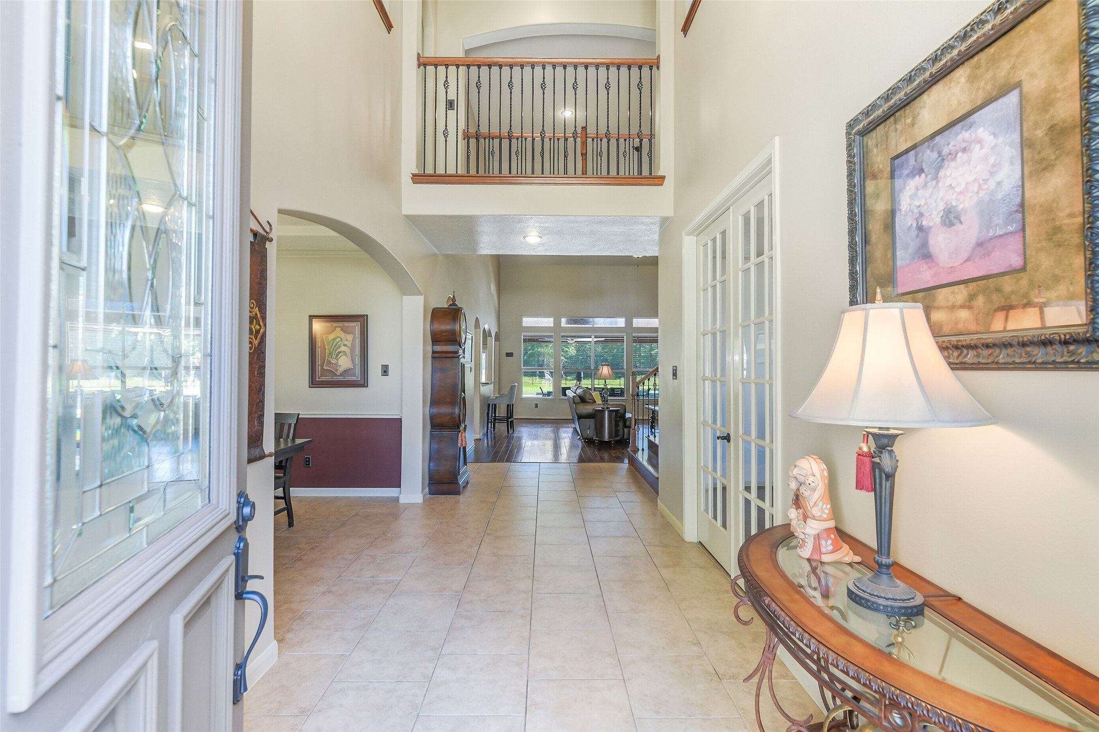 32711 Tall Oaks Way Magnolia, TX 77354 - Photo 5 of 50 a view of a hallway with furniture and a chandelier