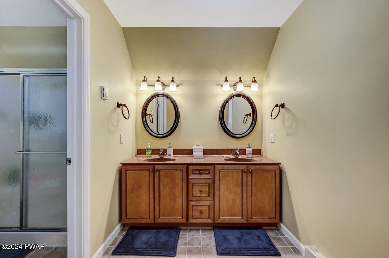 3295 Northgate Road Lake Ariel, PA 18436 - Photo 45 of 111 a bathroom with a sink and a mirror