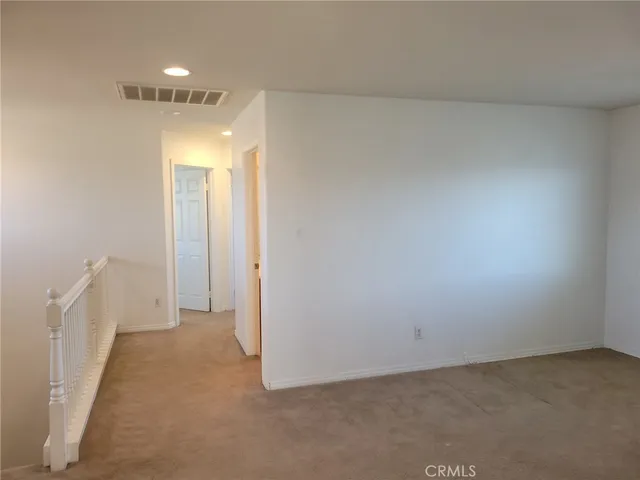 a view of hallway hall with a couch