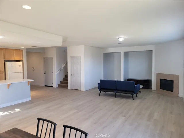 an empty room with furniture and a window