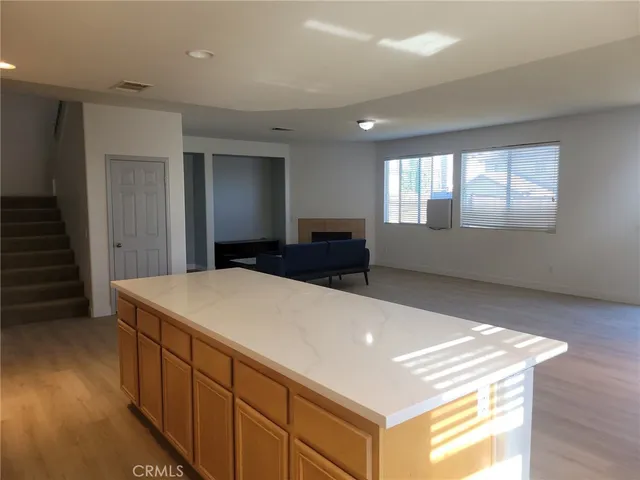 a living room with a furniture and windows