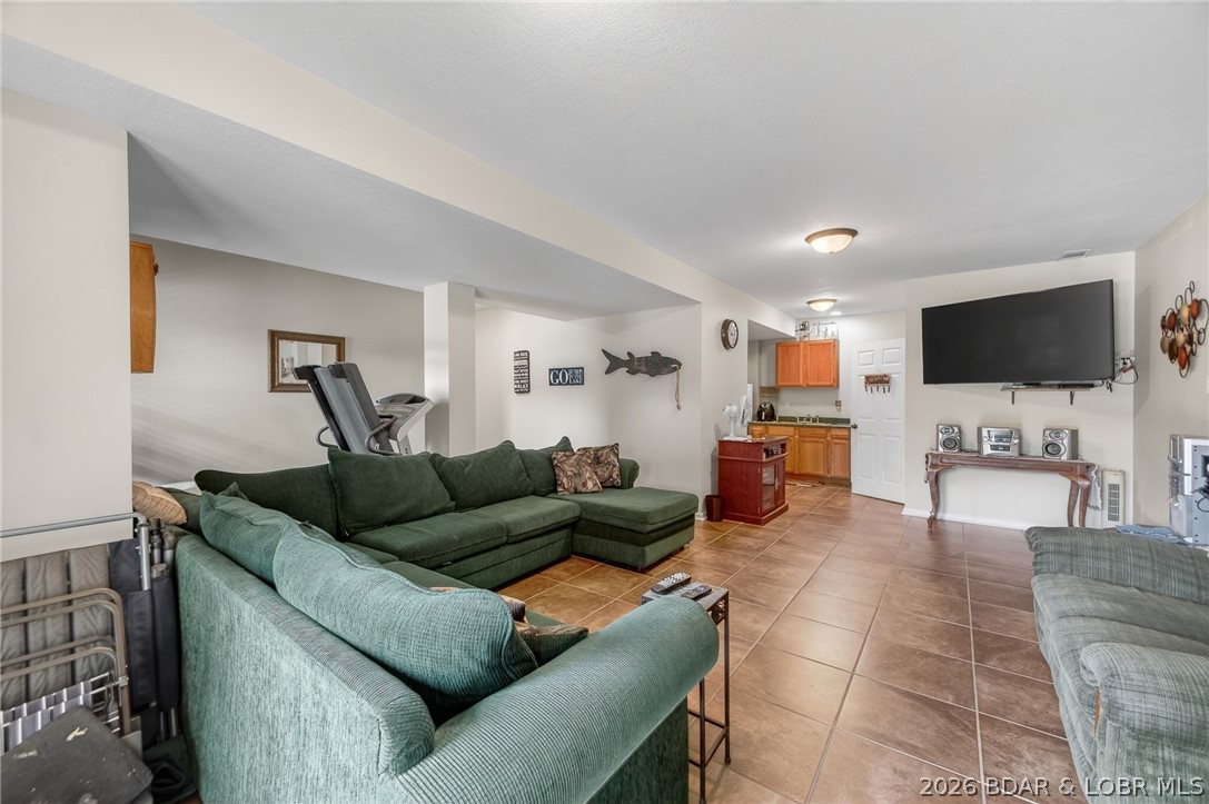 1359 Lick Creek Road Edwards, MO 65326 - Photo 27 of 67 Lower level living room