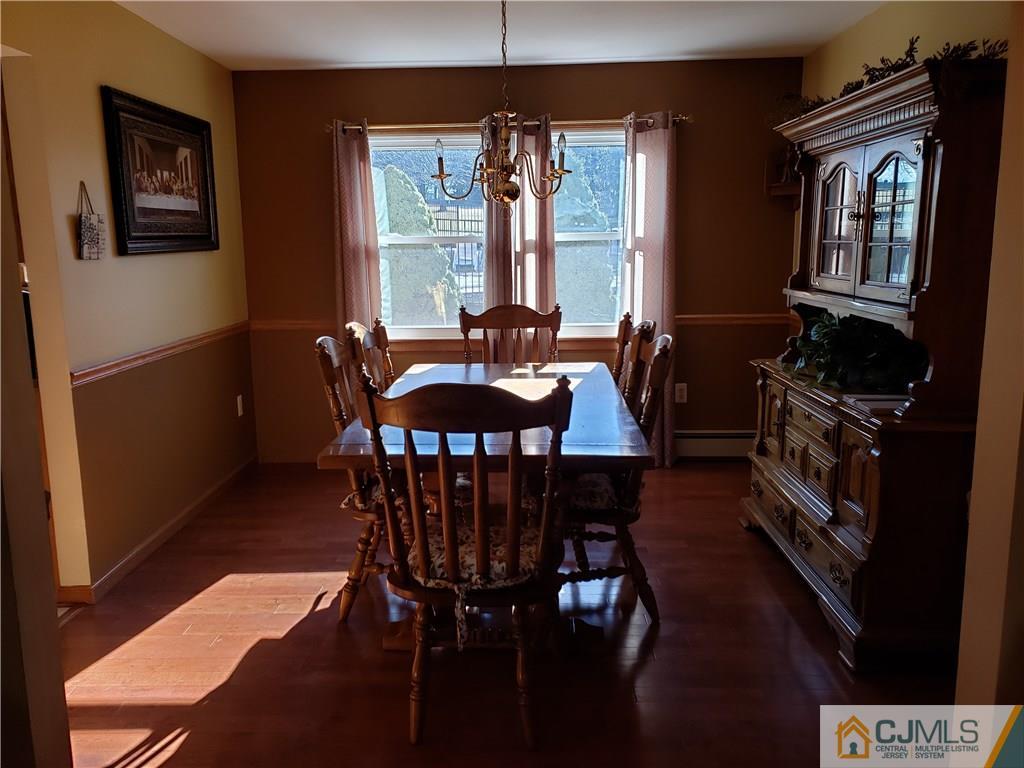 104 Rymon Road Washington, NJ 07882 - Photo 8 of 25 a view of a dining room with furniture window and wooden floor