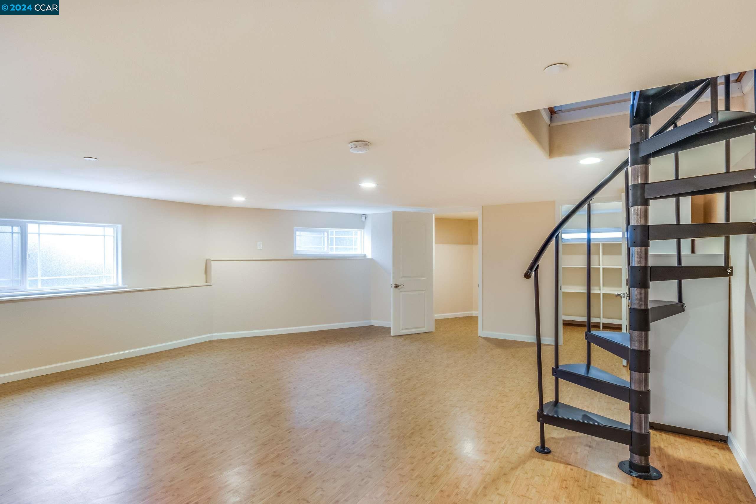 540 Helen Drive Millbrae, CA 94030 - Photo 17 of 24 a view of entryway with stairs and wooden floor