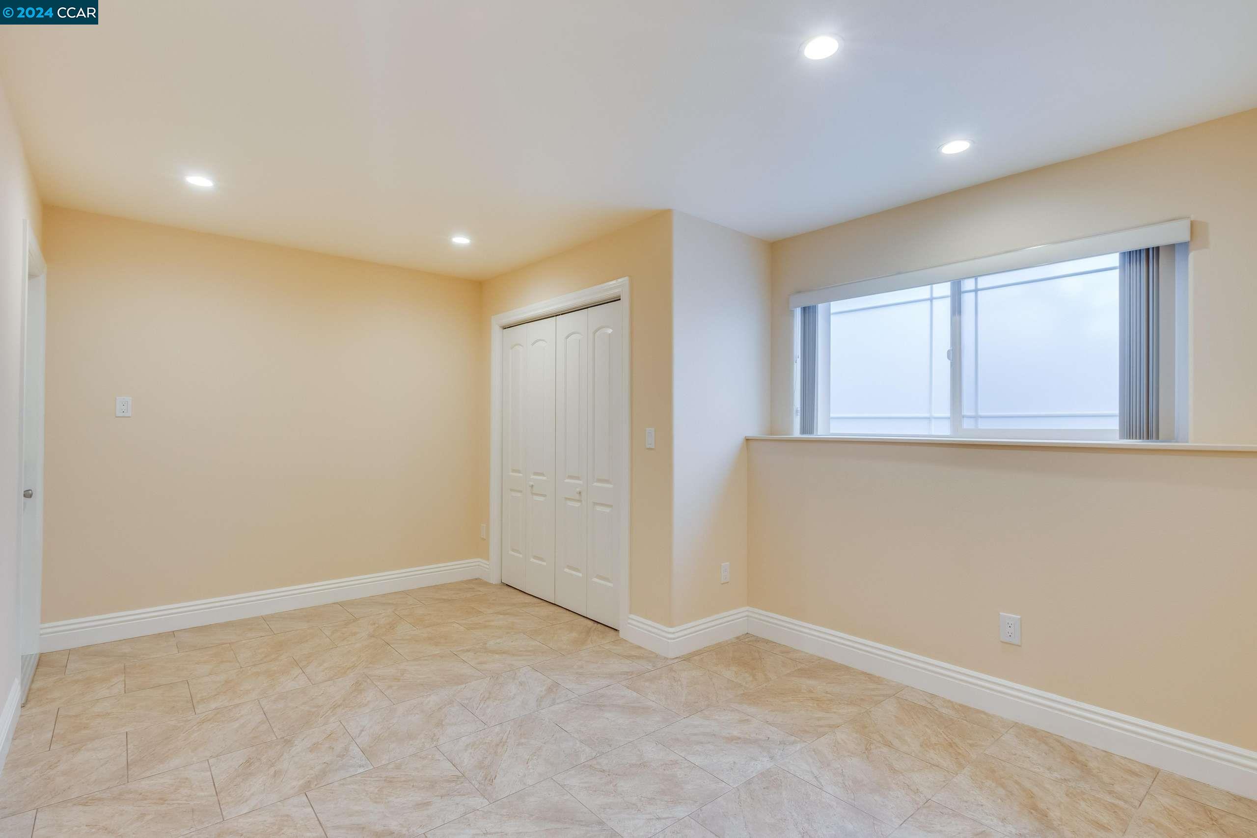 540 Helen Drive Millbrae, CA 94030 - Photo 19 of 24 an empty room with windows and closet