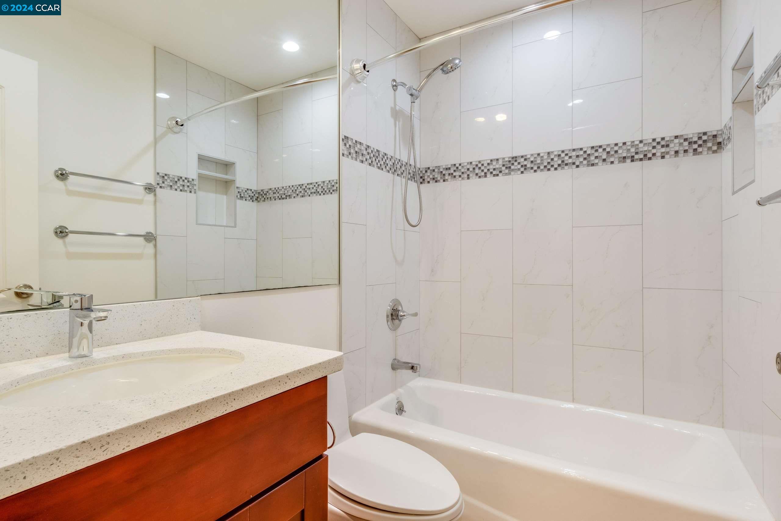 540 Helen Drive Millbrae, CA 94030 - Photo 20 of 24 a bathroom with a bathtub shower sink vanity and toilet