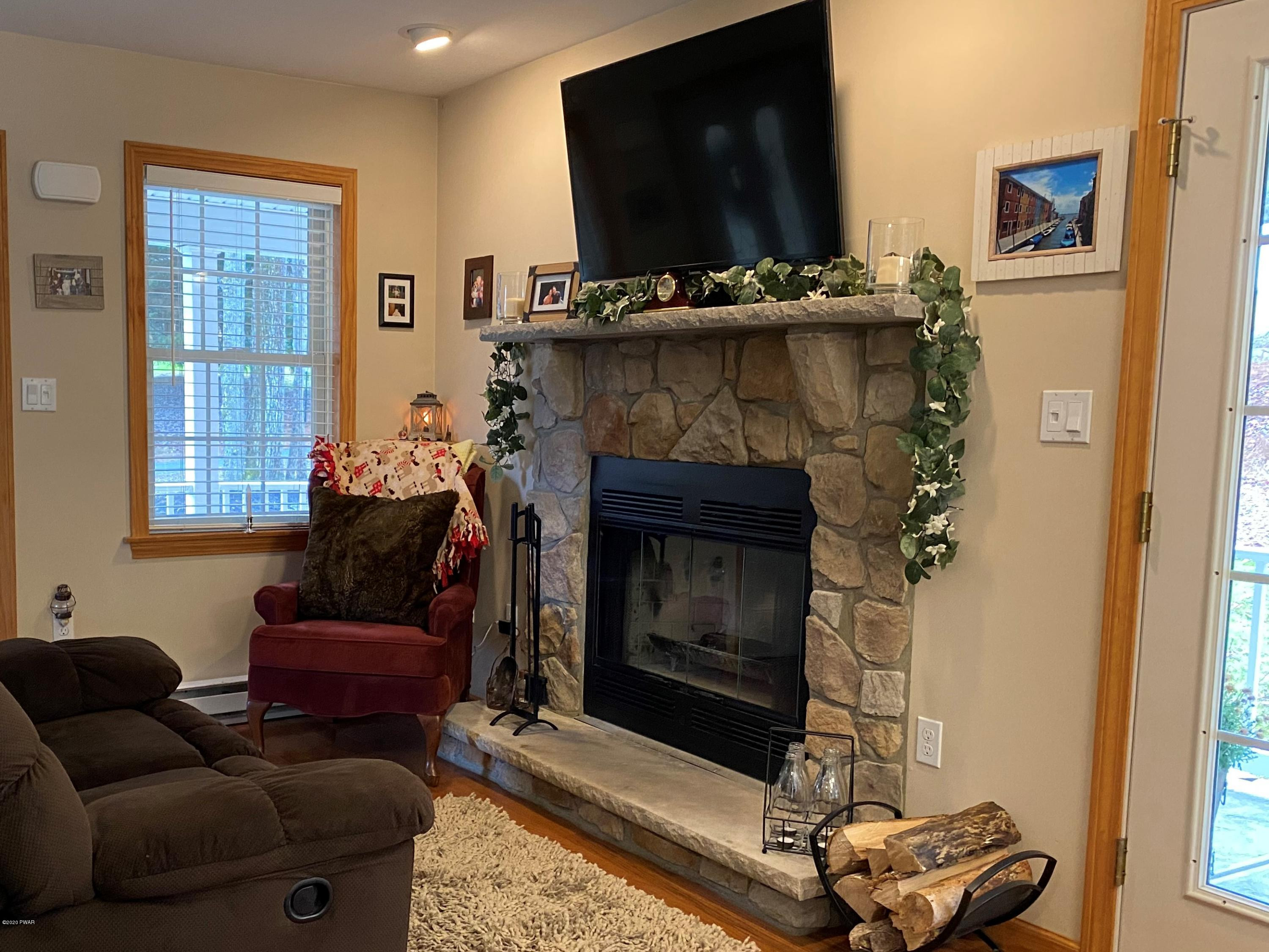 122 Well Road Greentown, PA 18426 - Photo 4 of 26 Wood-burning Fireplace for Chilly Winter