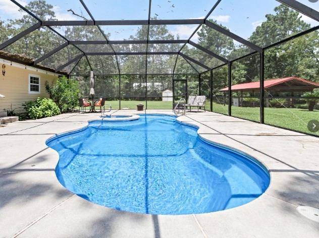 Saltwater pool and spa with fountain.