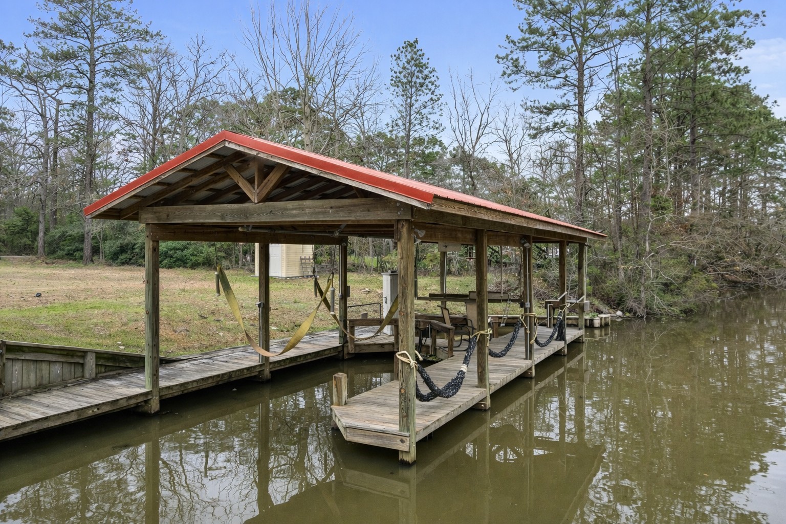 548 Creekside Estates Onalaska, TX 77360 - Photo 3 of 24 Boat house with boat lift, jetski lift and fish cleaning station.