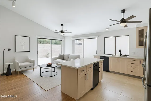 a kitchen with a sink stove and cabinets