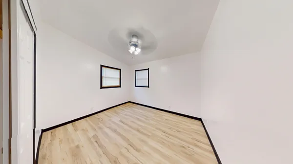 a view of empty room with windows