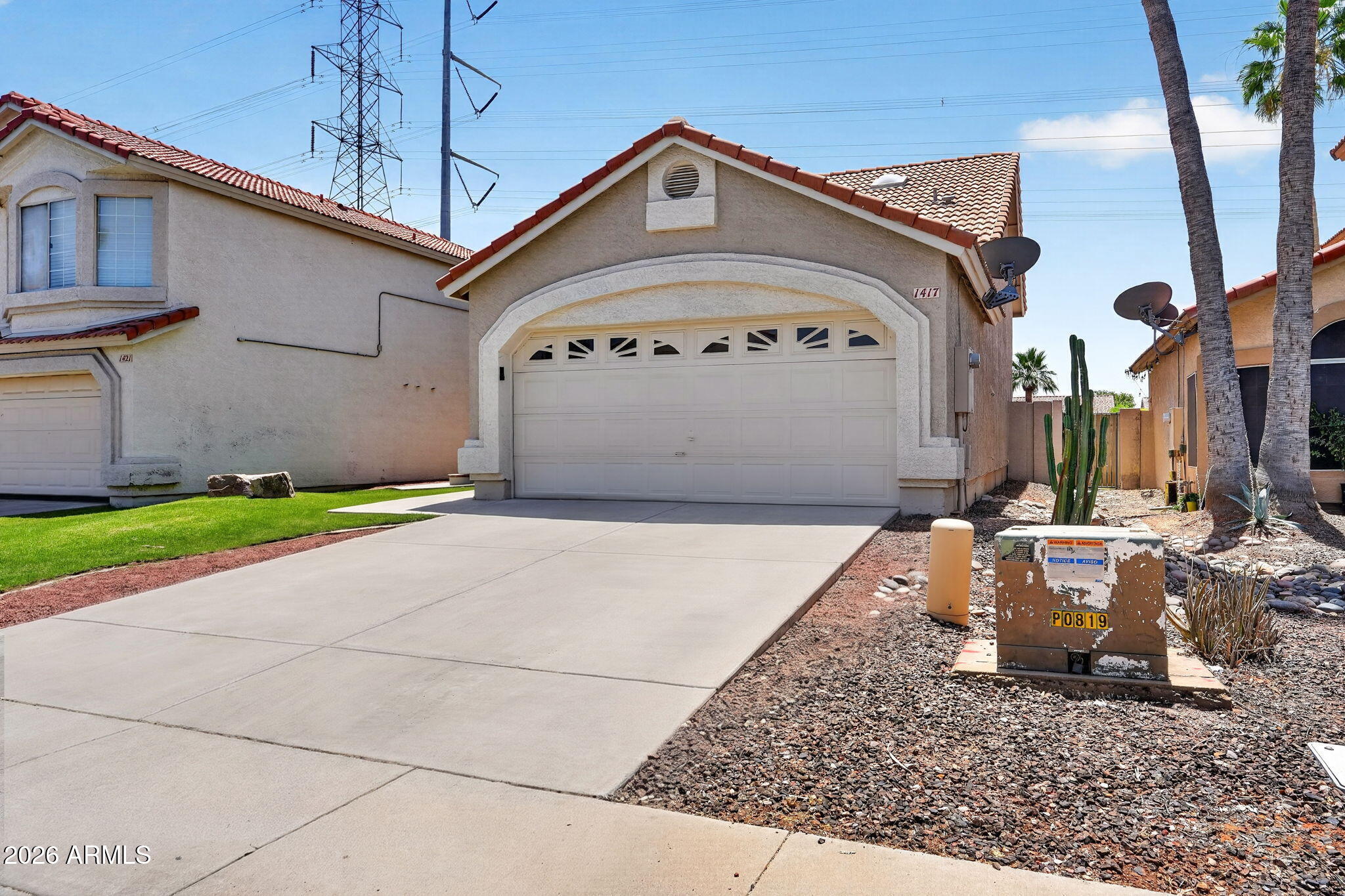 1417 East Mineral Road Gilbert, AZ 85234 - Photo 7 of 59 a front view of a building with a yard