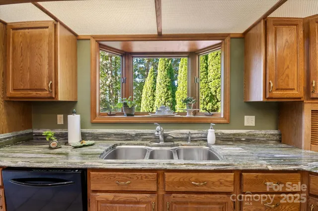 a bath tub sitting in a bathroom next to a window