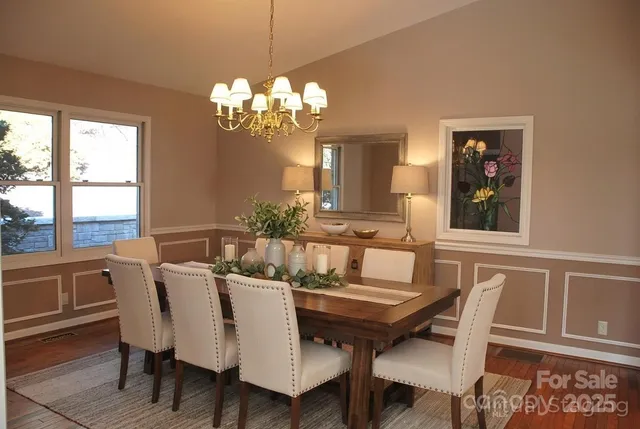 a living room with furniture and large windows