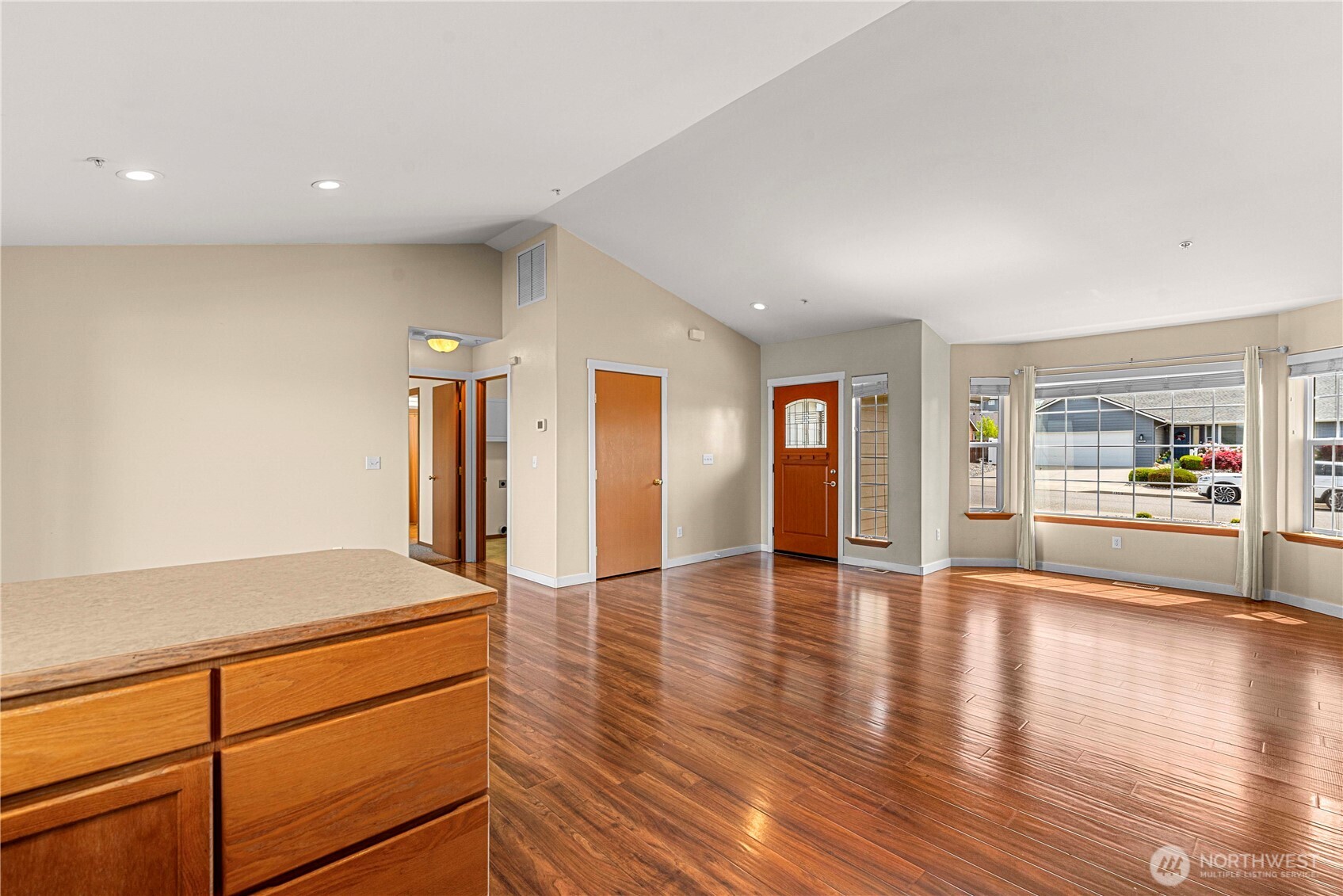 1308 Tractor Loop East Wenatchee, WA 98802 - Photo 13 of 35 a view of an empty room with wooden floor and a window