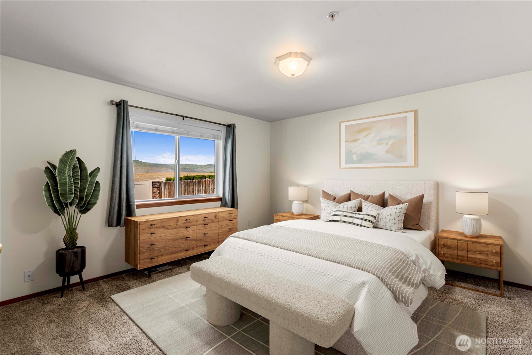 1308 Tractor Loop East Wenatchee, WA 98802 - Photo 16 of 35 a bedroom with a bed and a painting on the wall
