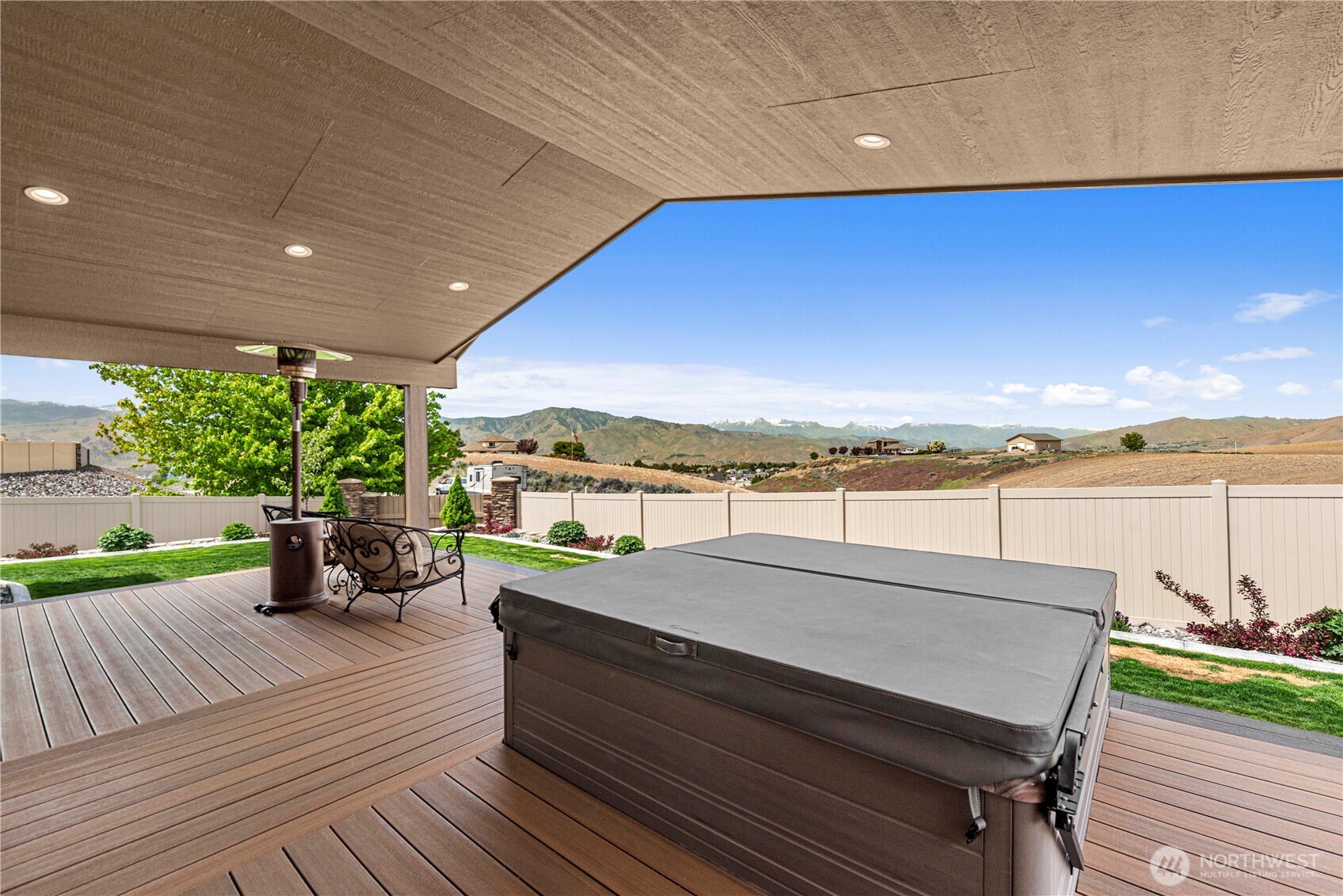 1308 Tractor Loop East Wenatchee, WA 98802 - Photo 21 of 35 a view of a terrace with wooden floor and lake view