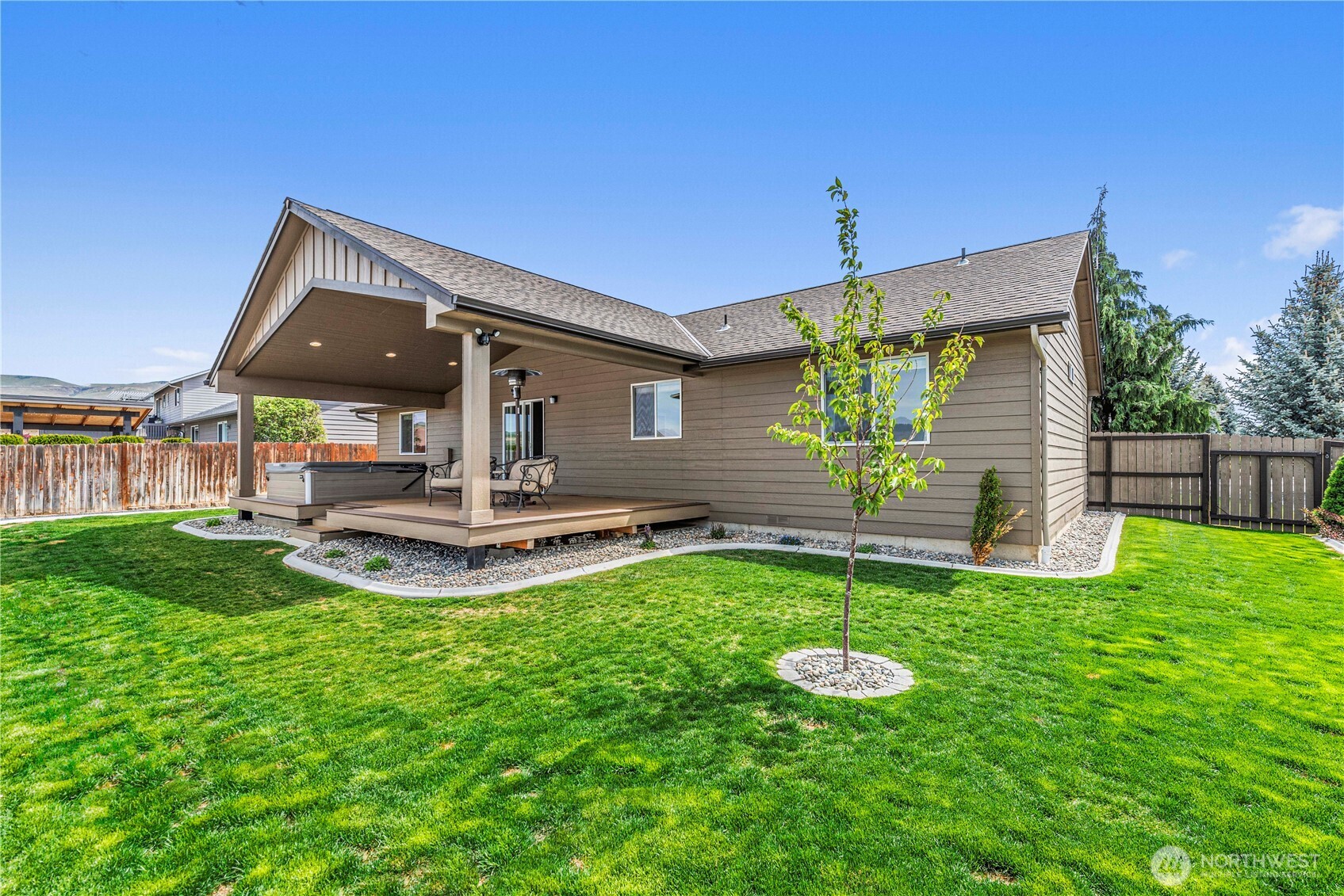 1308 Tractor Loop East Wenatchee, WA 98802 - Photo 31 of 35 a view of a house with a yard and sitting area