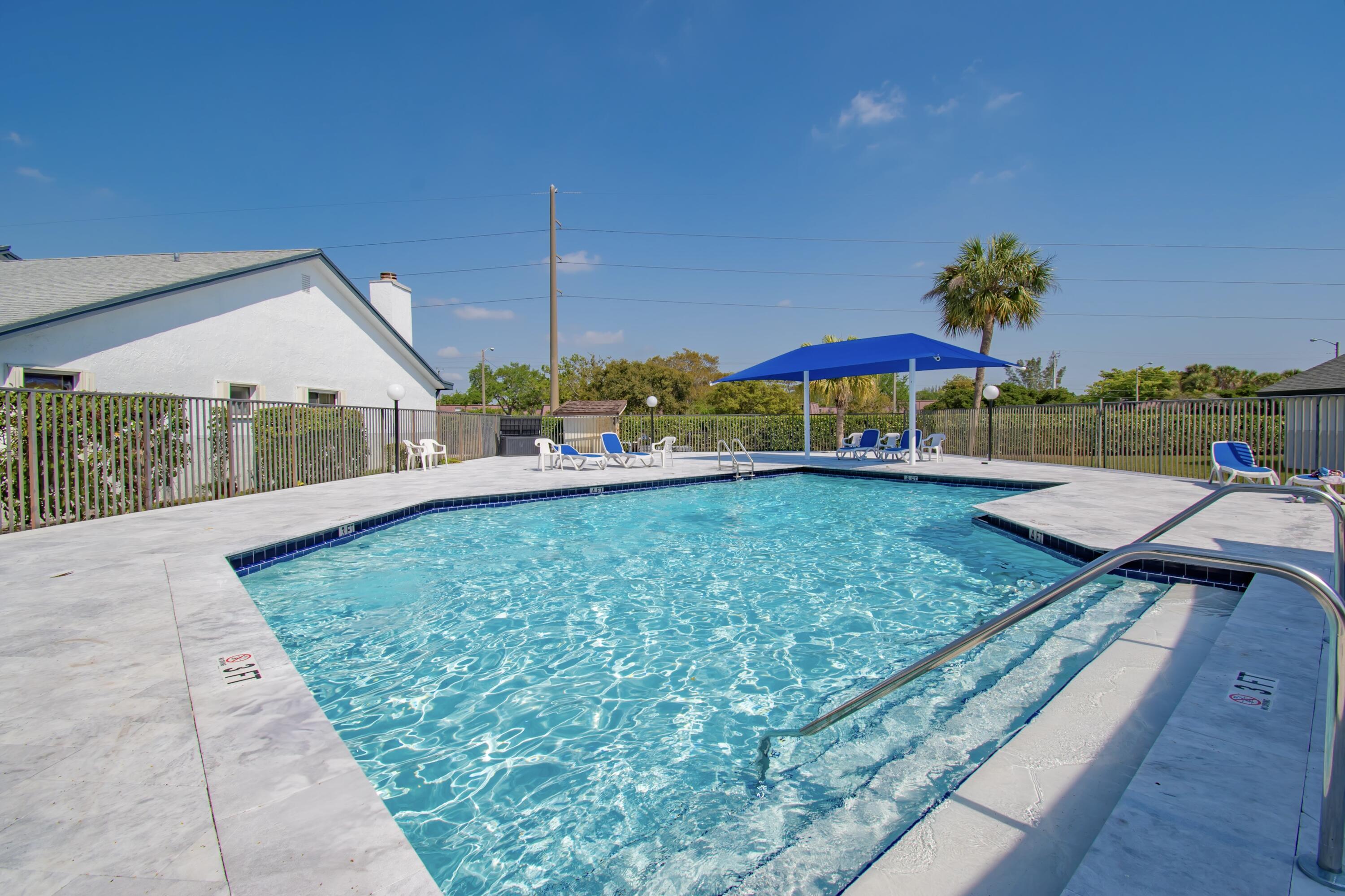 7838 Cypress Crescent Boca Raton, FL 33433 - Photo 23 of 24 a view of a house with a yard and sitting area