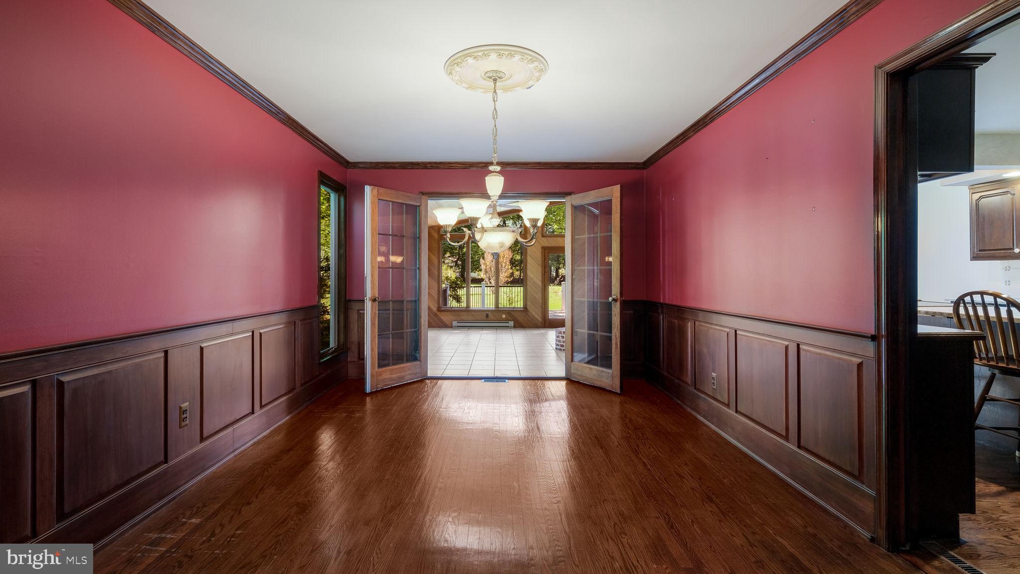 2775 Red Gate Drive Doylestown, PA 18902 - Photo 8 of 38 a hallway with wooden floor chandelier and entryway