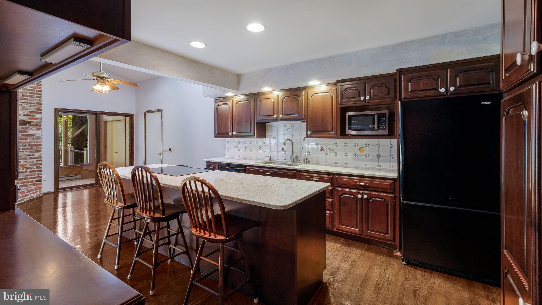 2775 Red Gate Drive Doylestown, PA 18902 - Photo 9 of 38 a kitchen with stainless steel appliances granite countertop a sink and a refrigerator