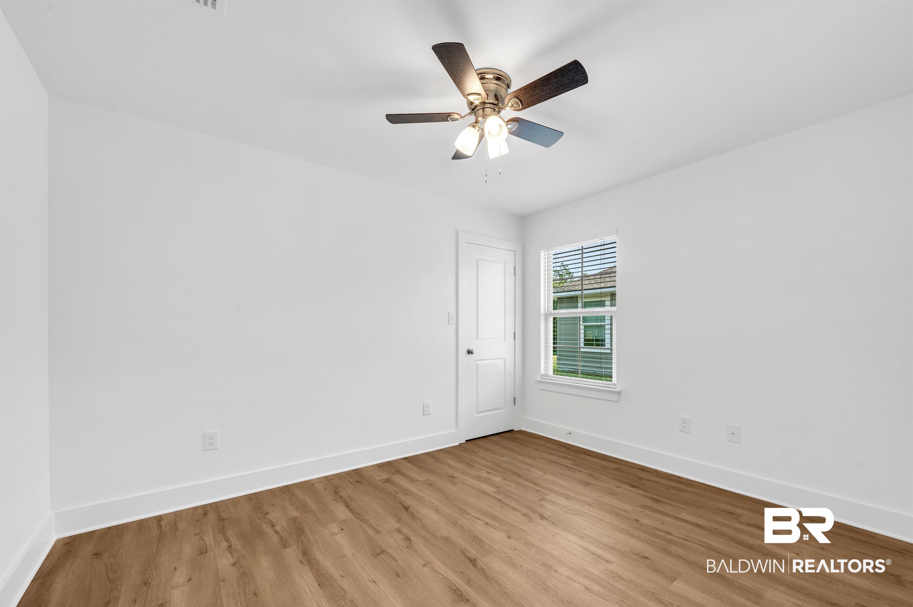 22045 8th Street Silverhill, AL 36576 - Photo 28 of 39 Bedroom featuring light wood-style floors, baseboards, and ceiling fan