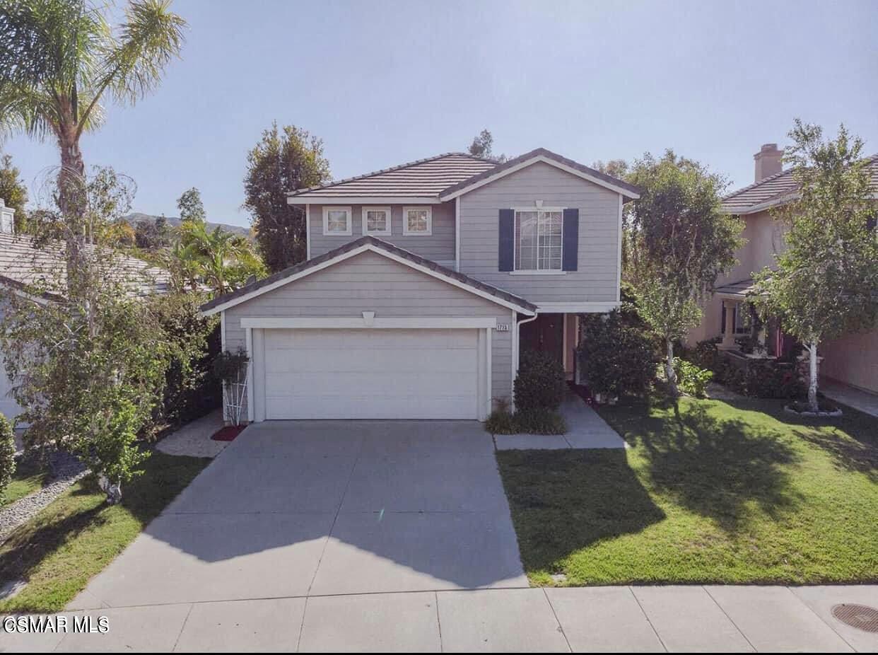 1715 Empty Saddle Road Simi Valley, CA 93063 - Photo 1 of 20 a front view of a house with a yard and garage